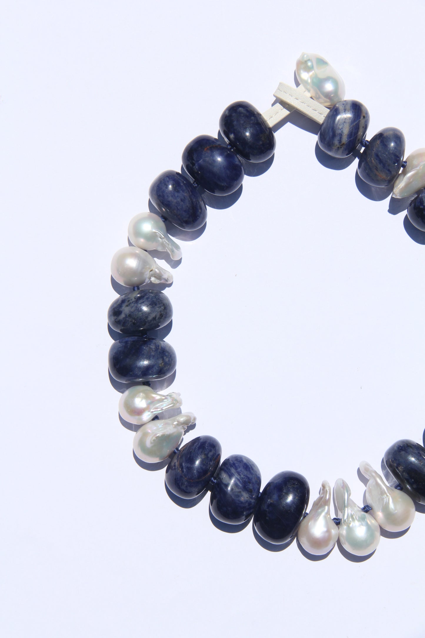 Necklace: pearls, blue vein stone
