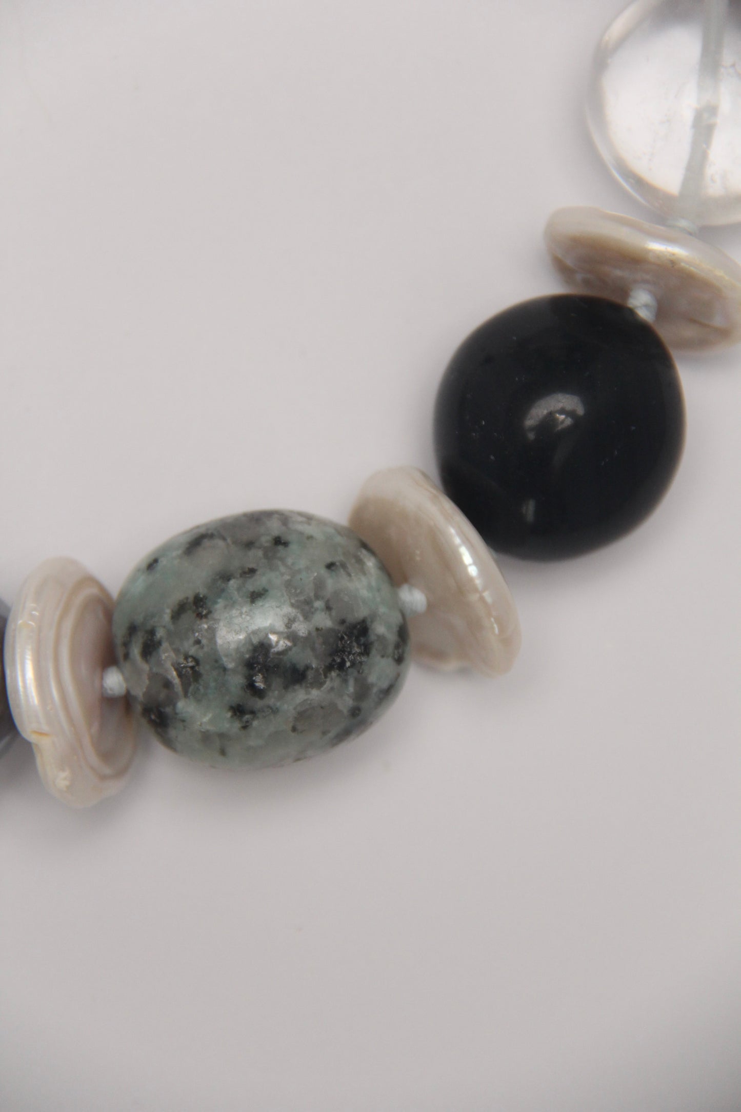Necklace: herkimer diamond, kiwi stone, obsidian, quartz, moonstone, titanium magnet