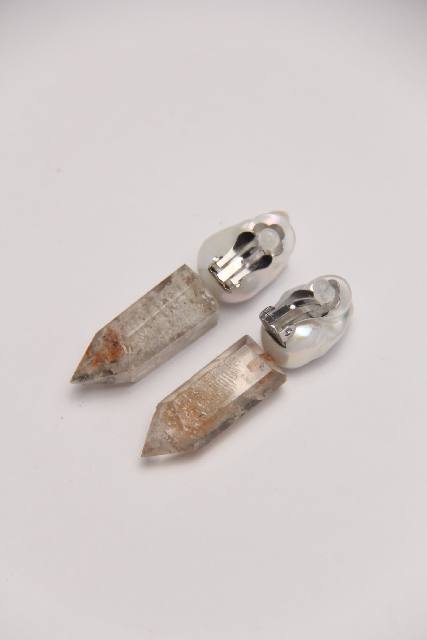 Earrings: pearls, phantom quartz