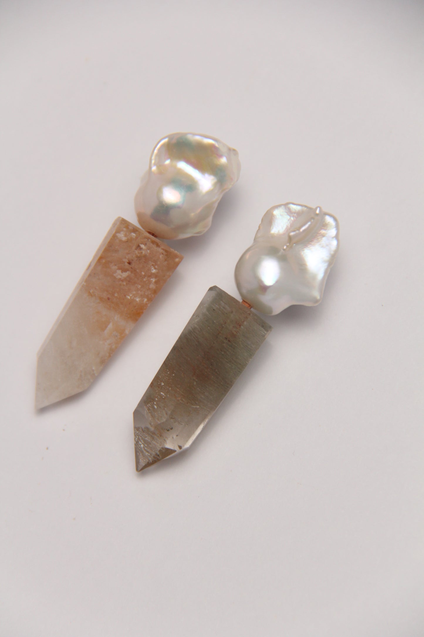 Earrings: pearls, phantom quartz