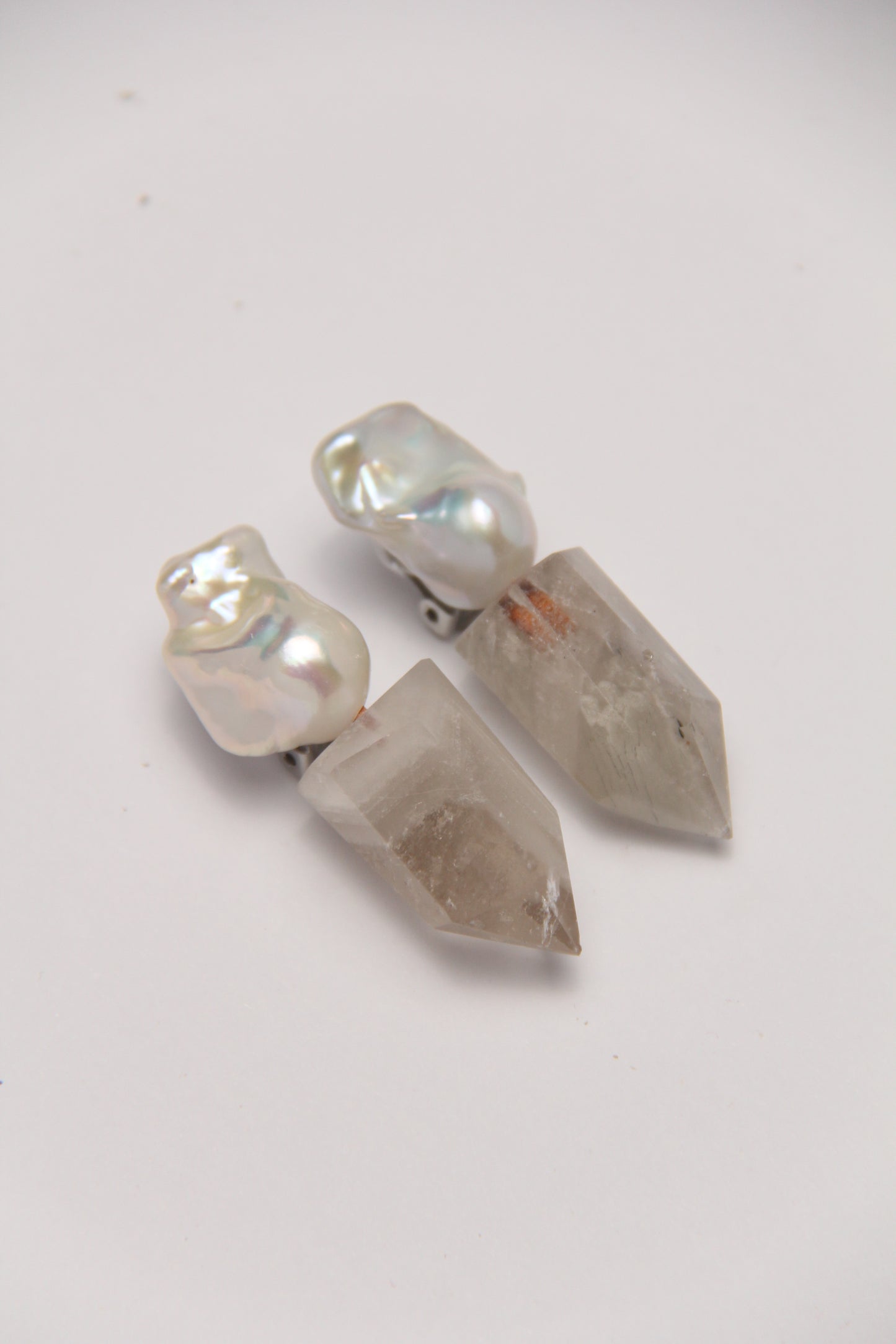 Earrings: pearls, phantom quartz