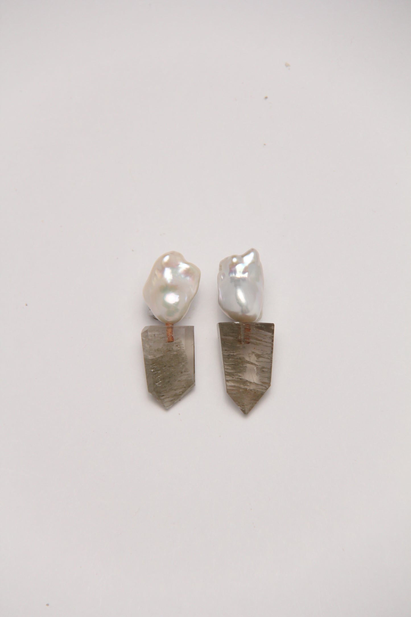 Earrings: pearls, phantom quartz