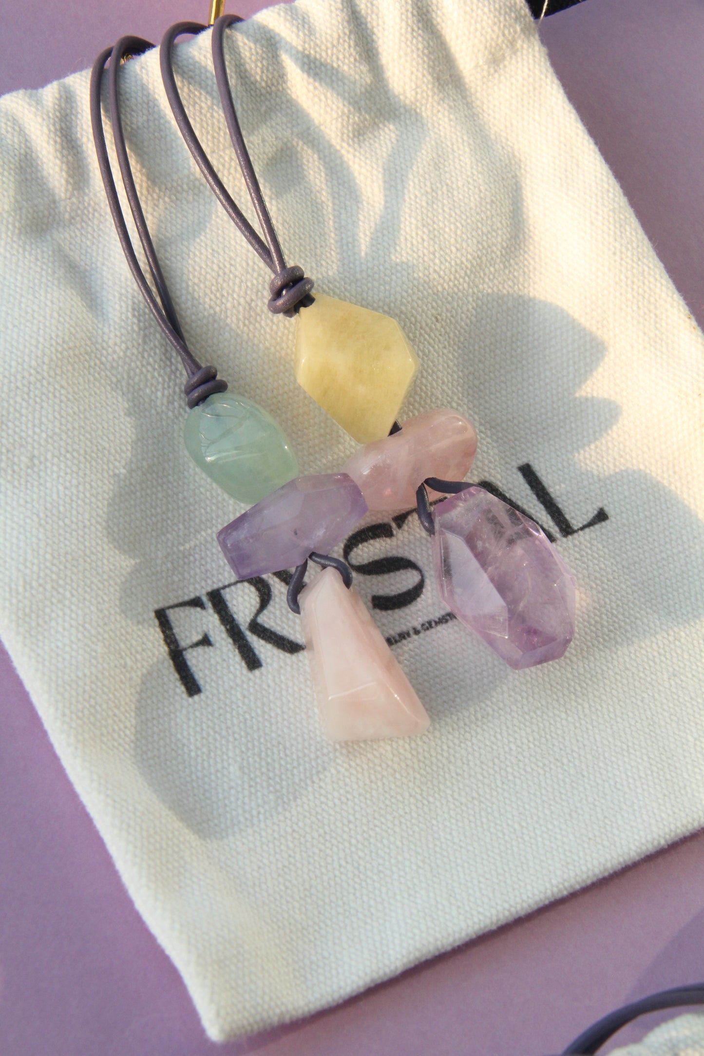 Pendant: morganite, amethyst, leather