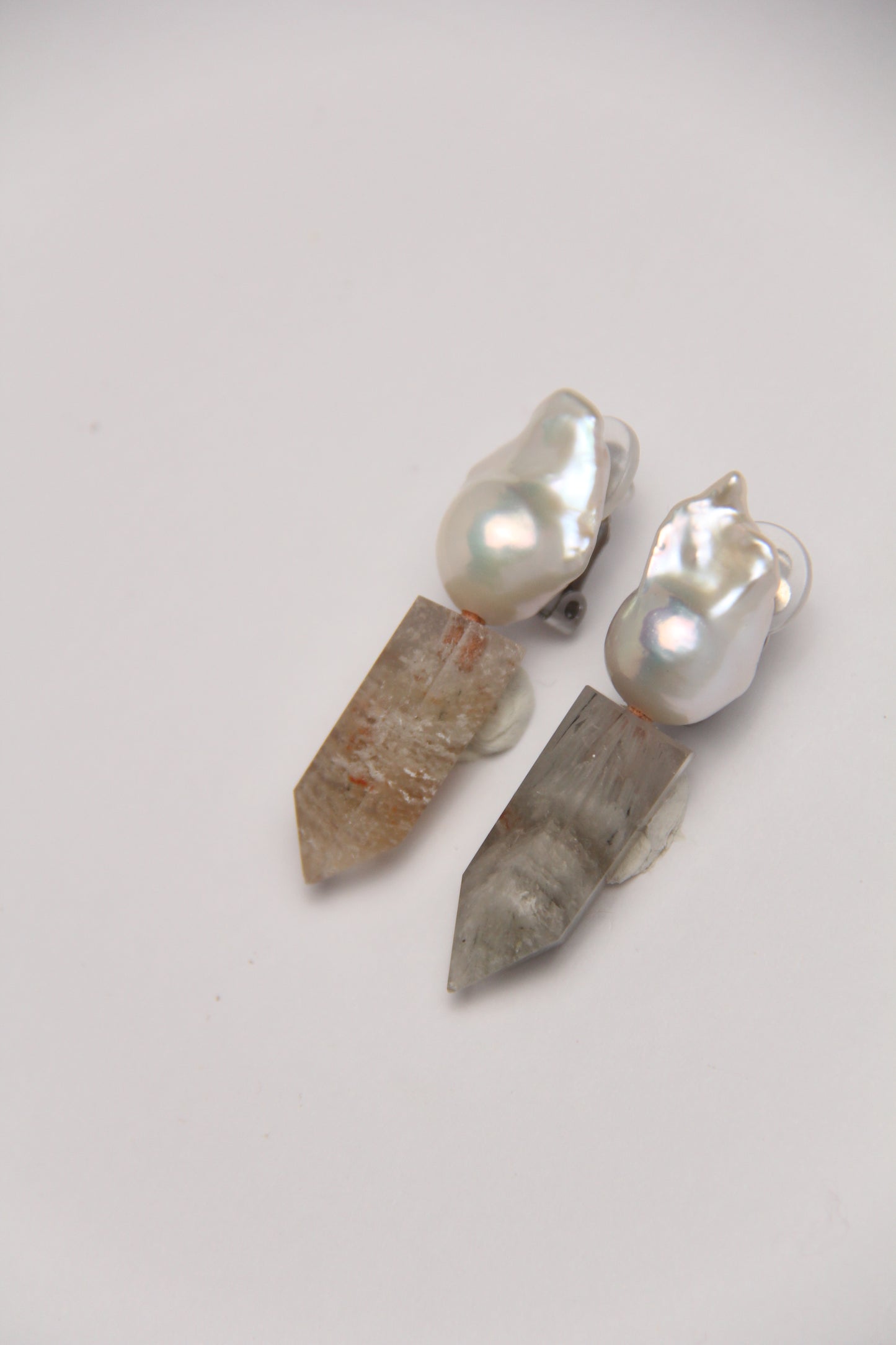 Earrings: pearls, phantom quartz