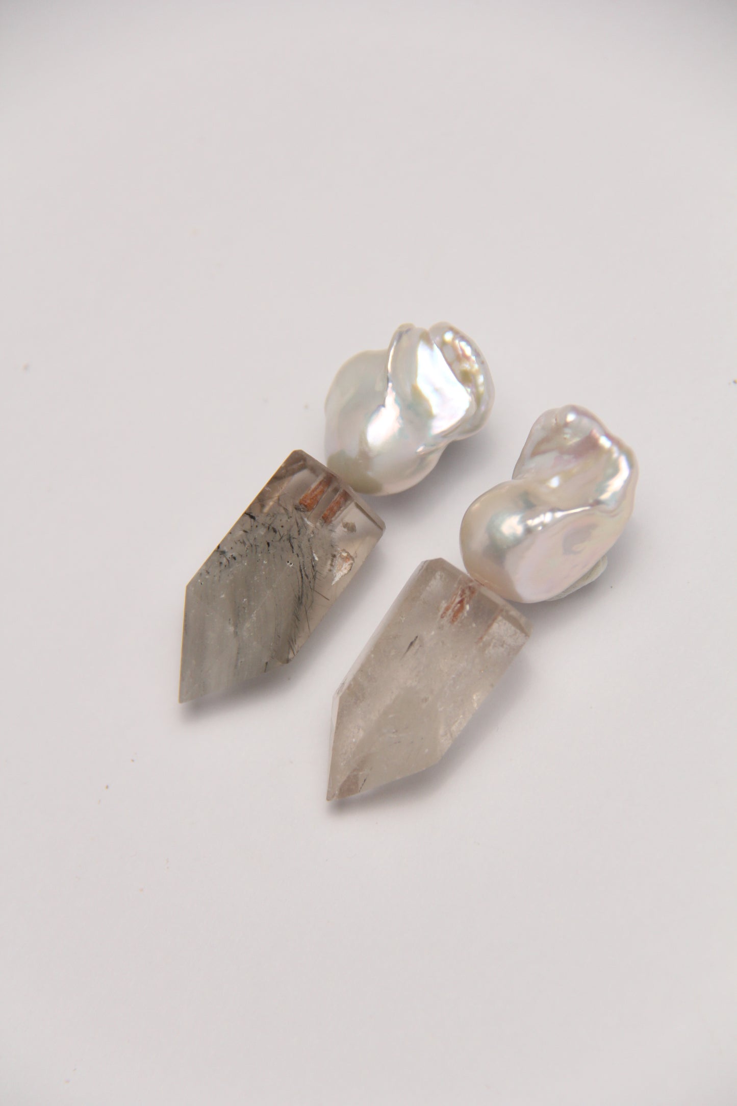 Earrings: pearls, phantom quartz