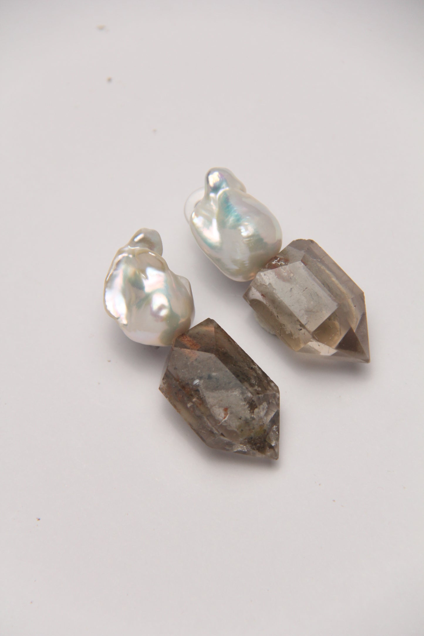 Earrings: pearls, phantom quartz