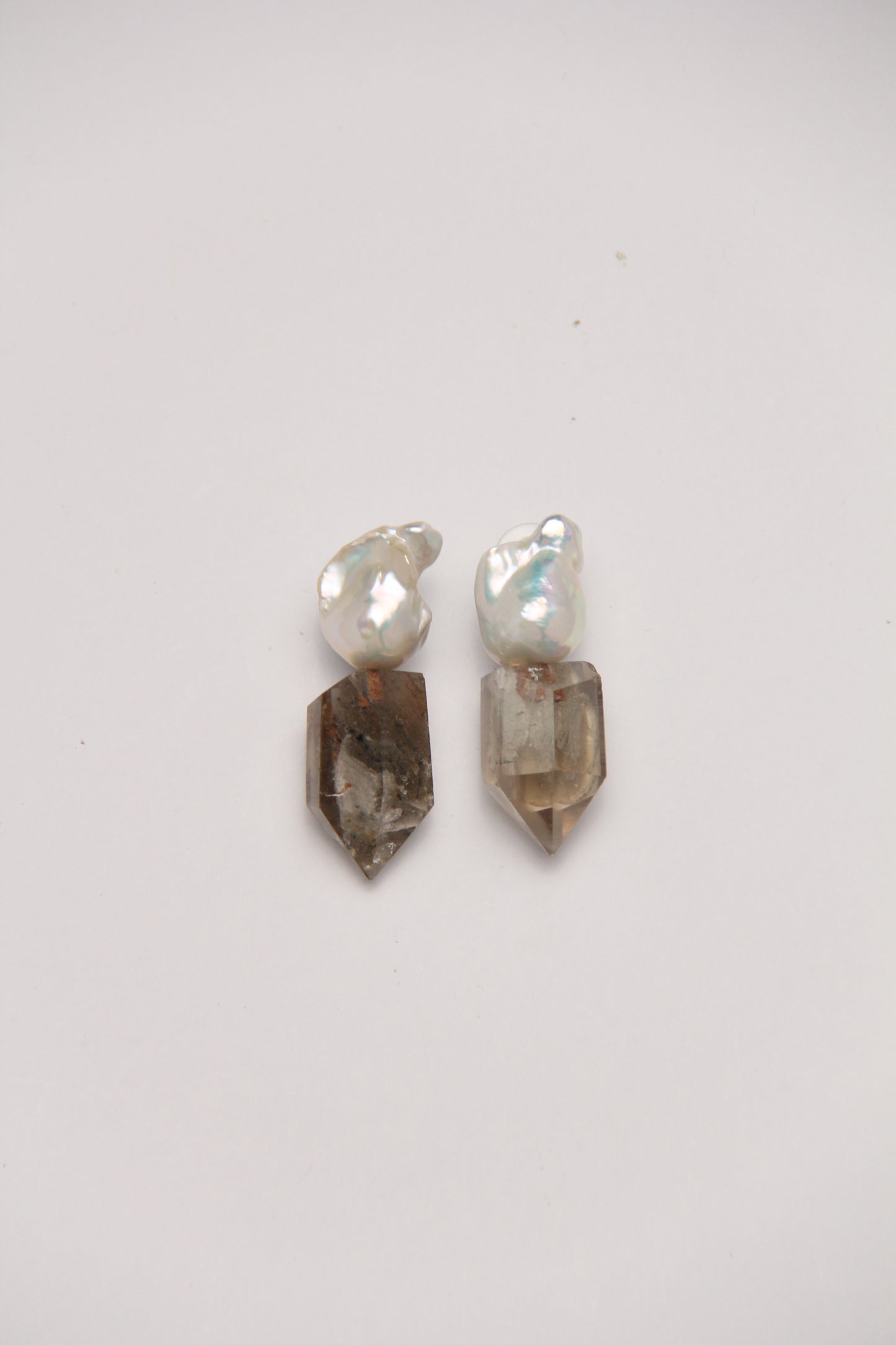 Earrings: pearls, phantom quartz