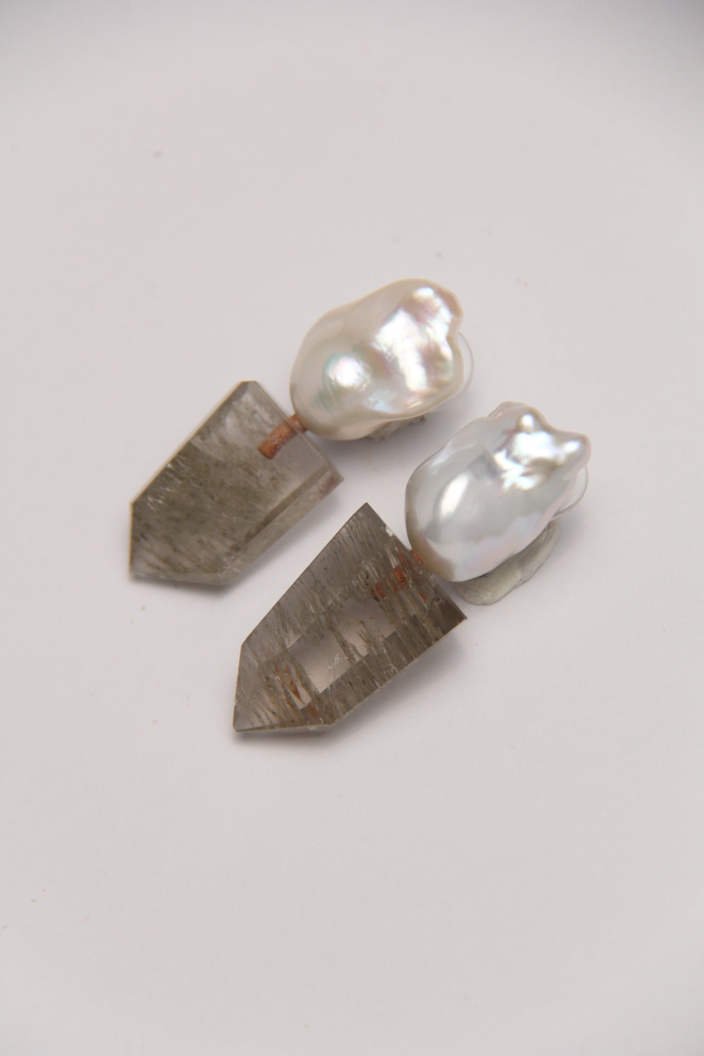 Earrings: pearls, phantom quartz
