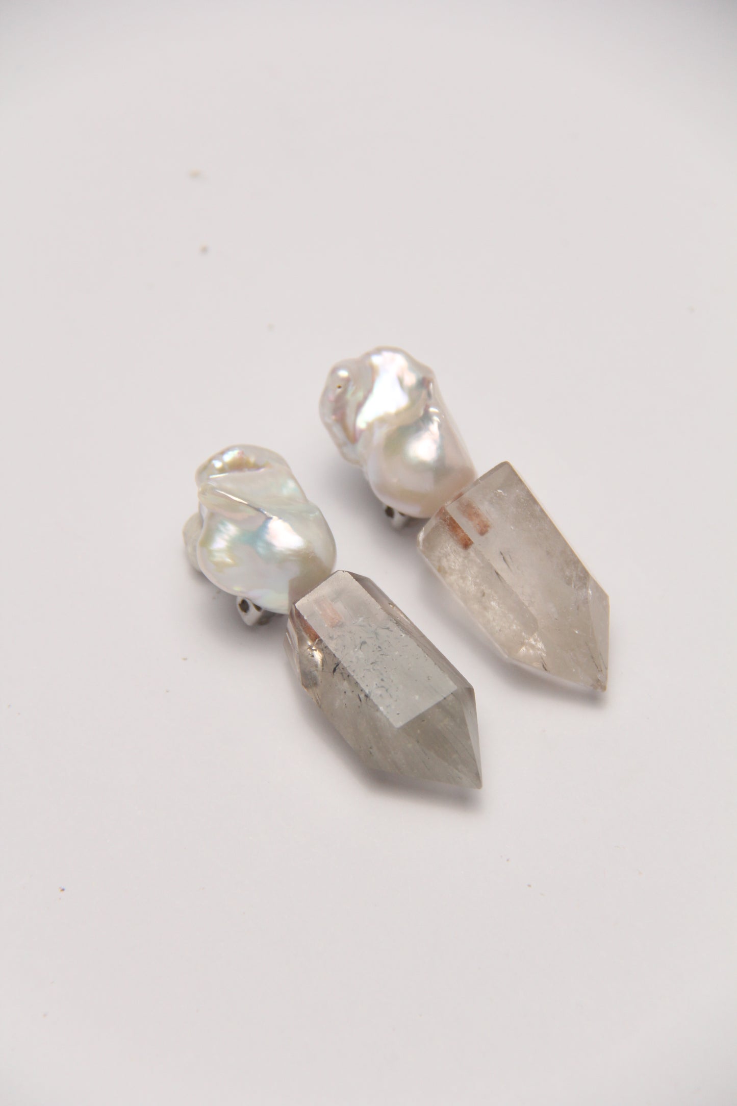 Earrings: pearls, phantom quartz