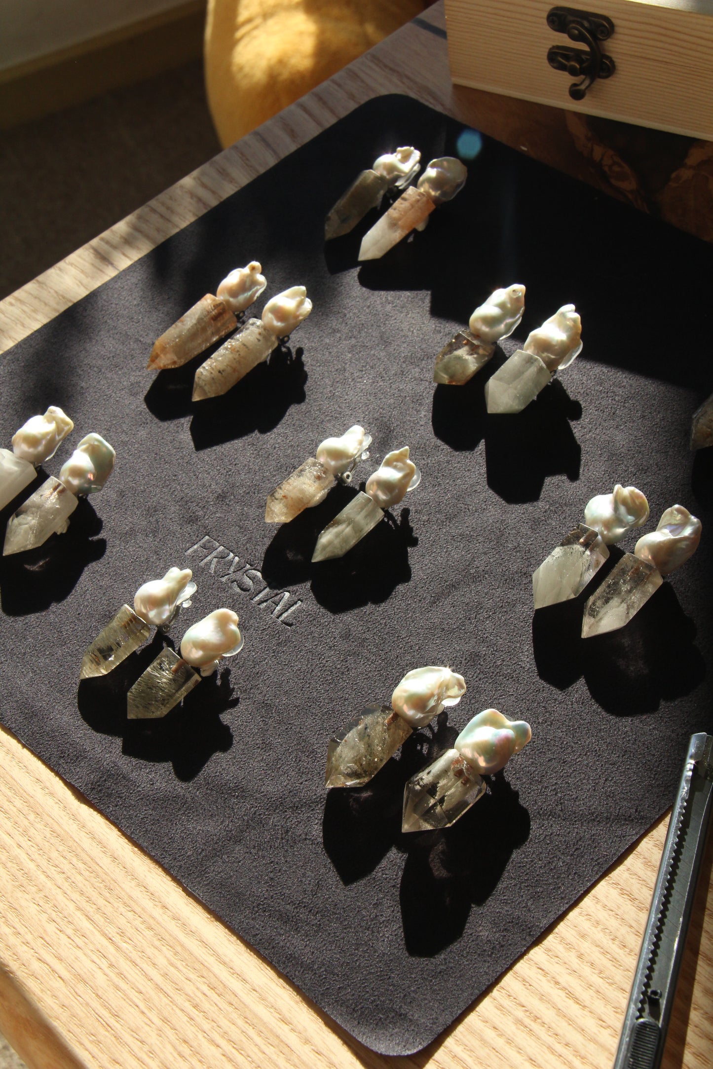 Earrings: pearls, phantom quartz