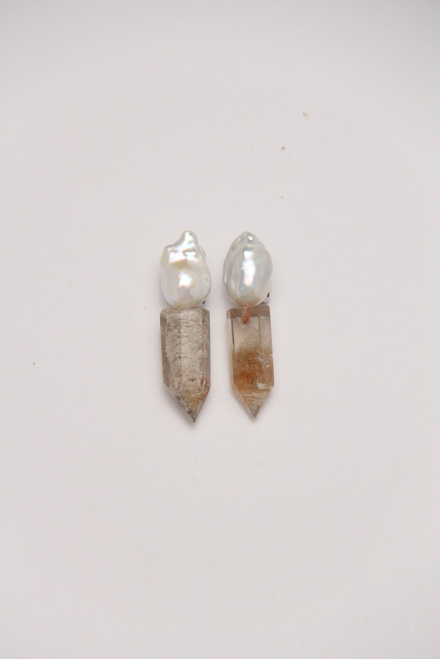 Earrings: pearls, phantom quartz