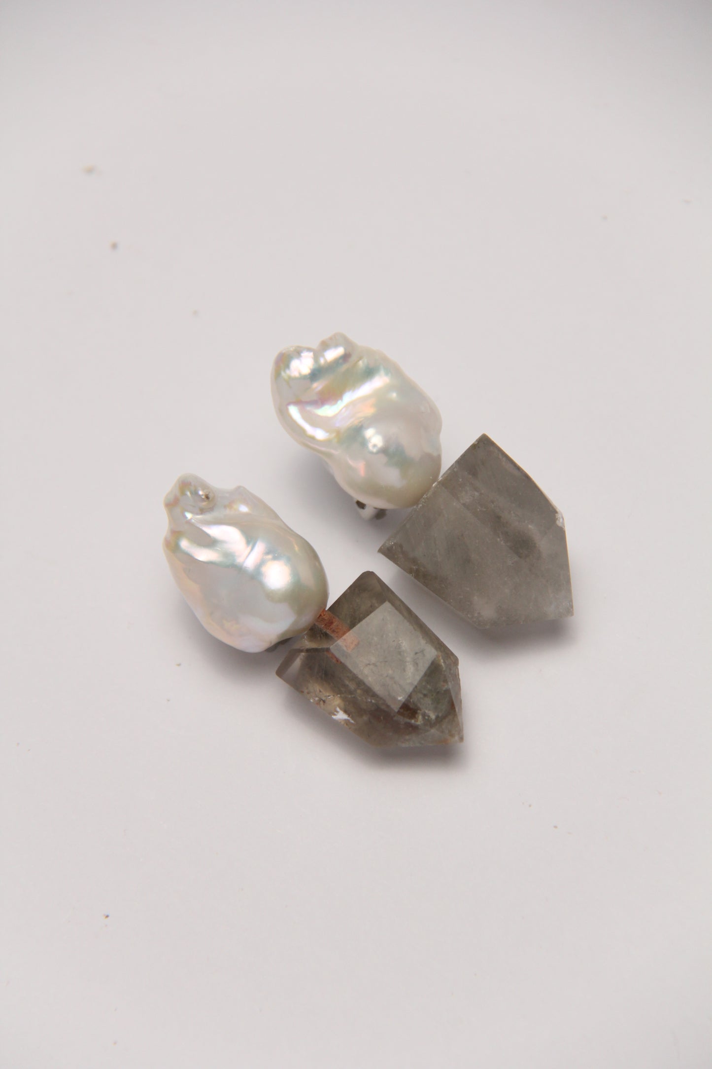 Earrings: pearls, phantom quartz