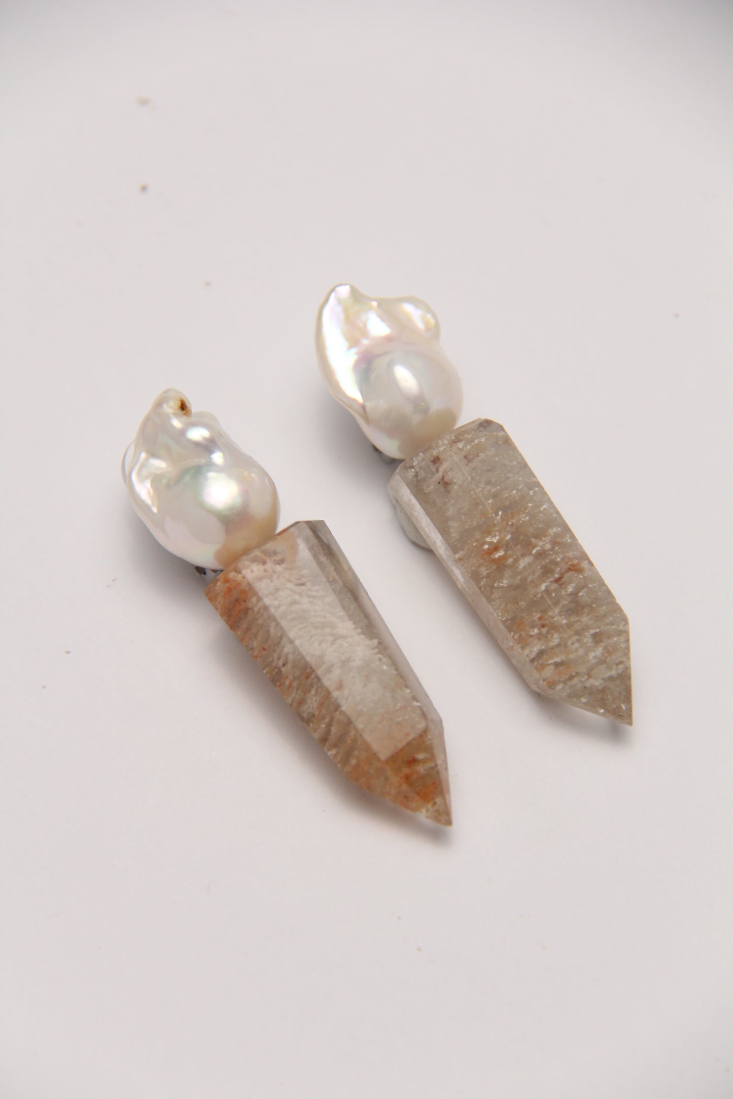 Earrings: pearls, phantom quartz