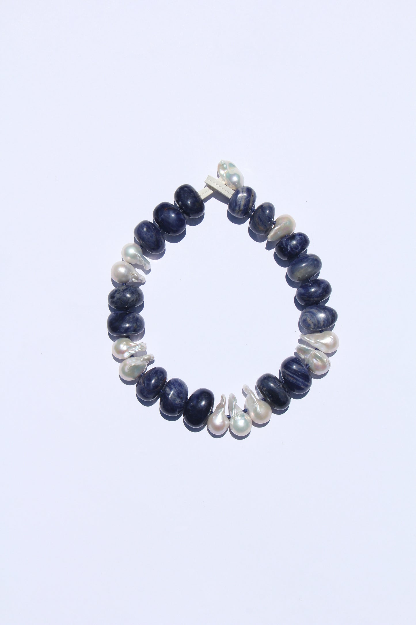 Necklace: pearls, blue vein stone