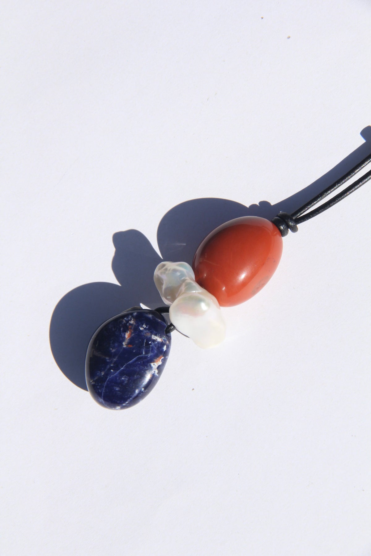 Necklace: red jasper stone, pearl, blue vein stone