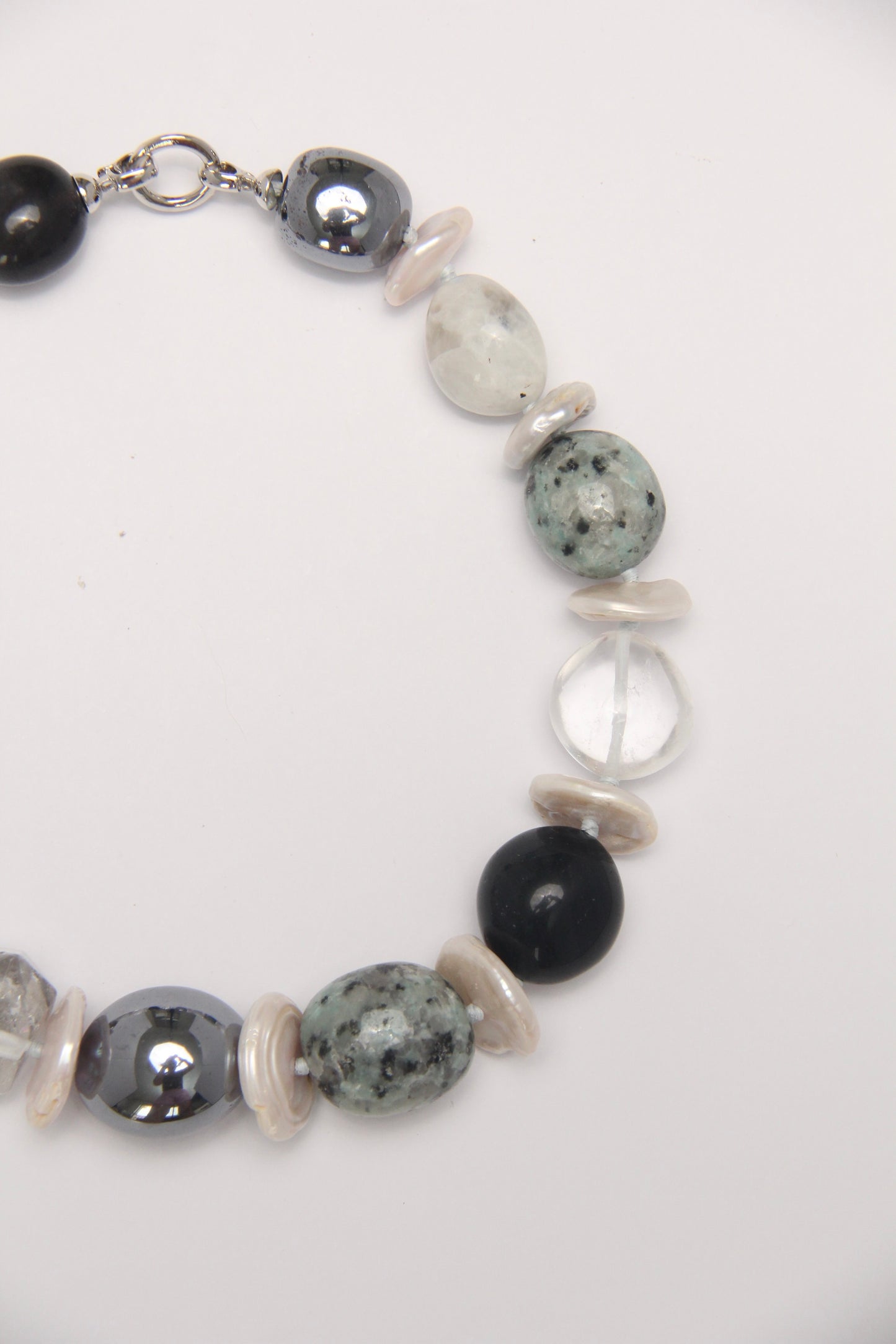 Necklace: herkimer diamond, kiwi stone, obsidian, quartz, moonstone, titanium magnet