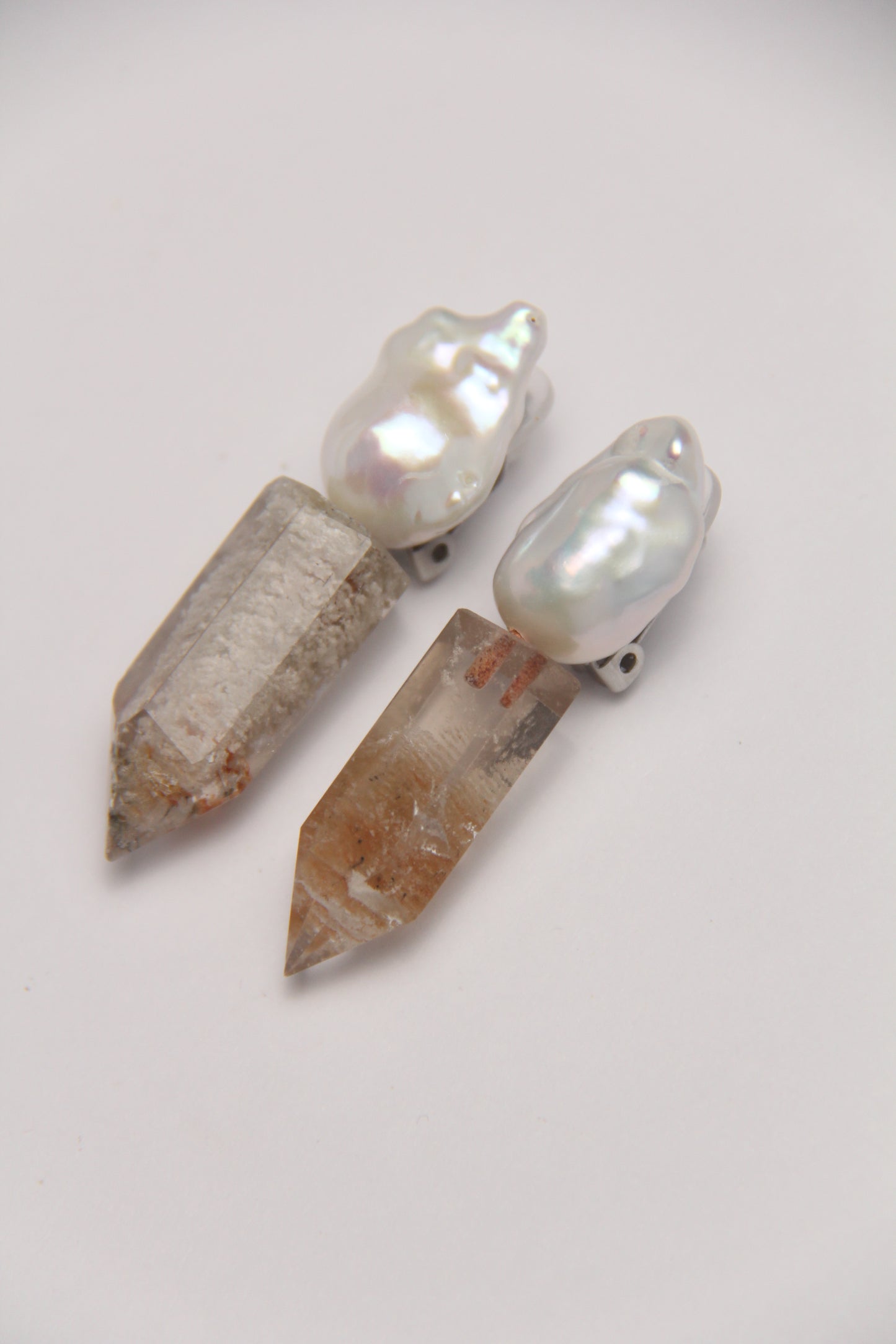 Earrings: pearls, phantom quartz