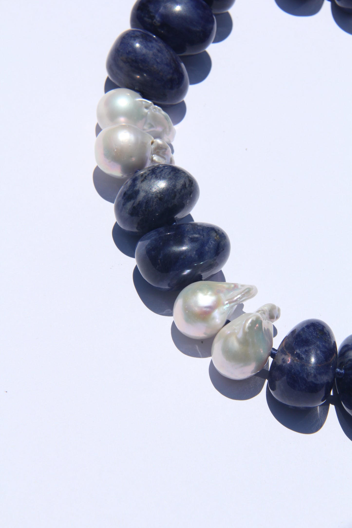 Necklace: pearls, blue vein stone