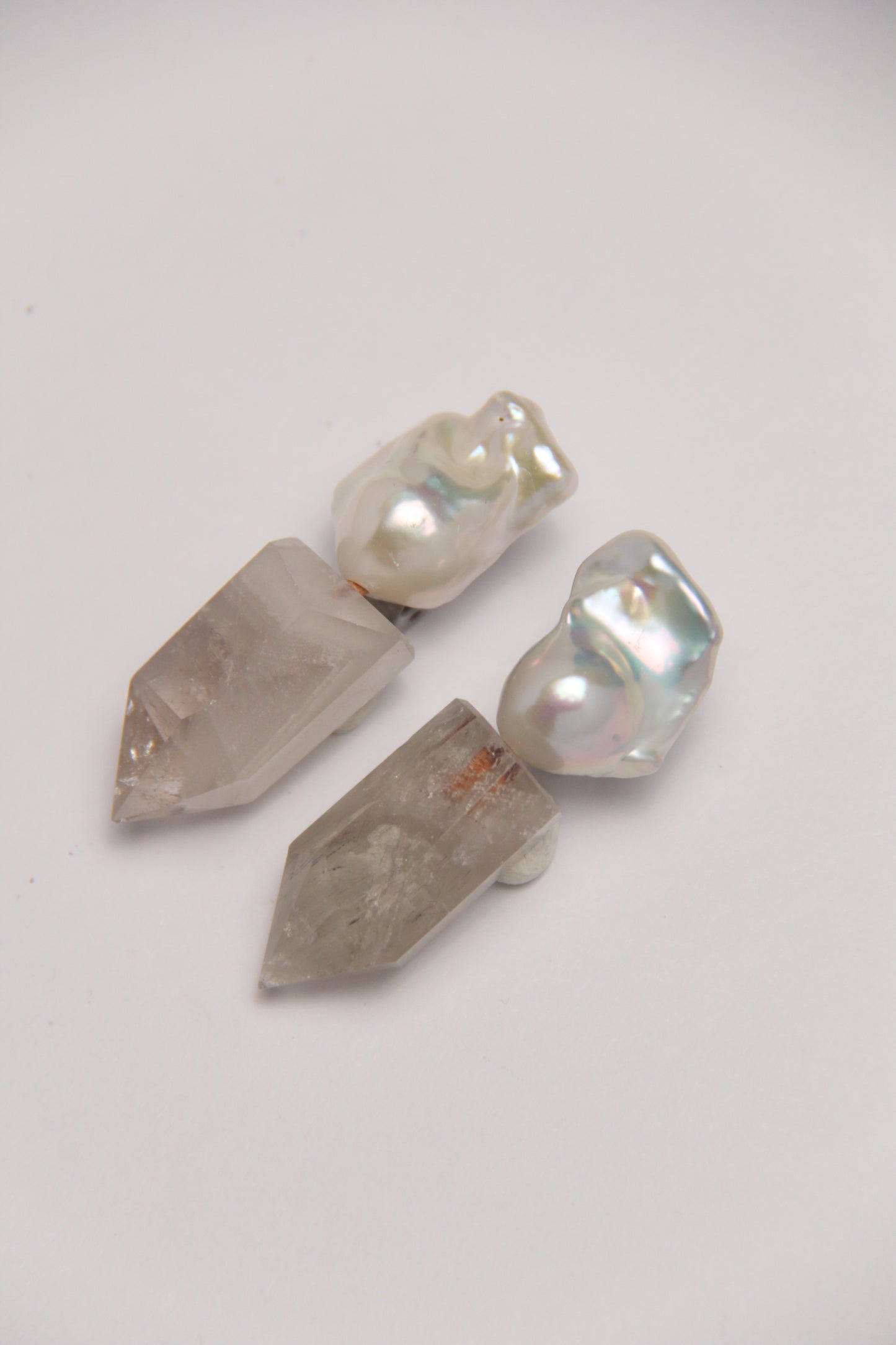 Earrings: pearls, phantom quartz