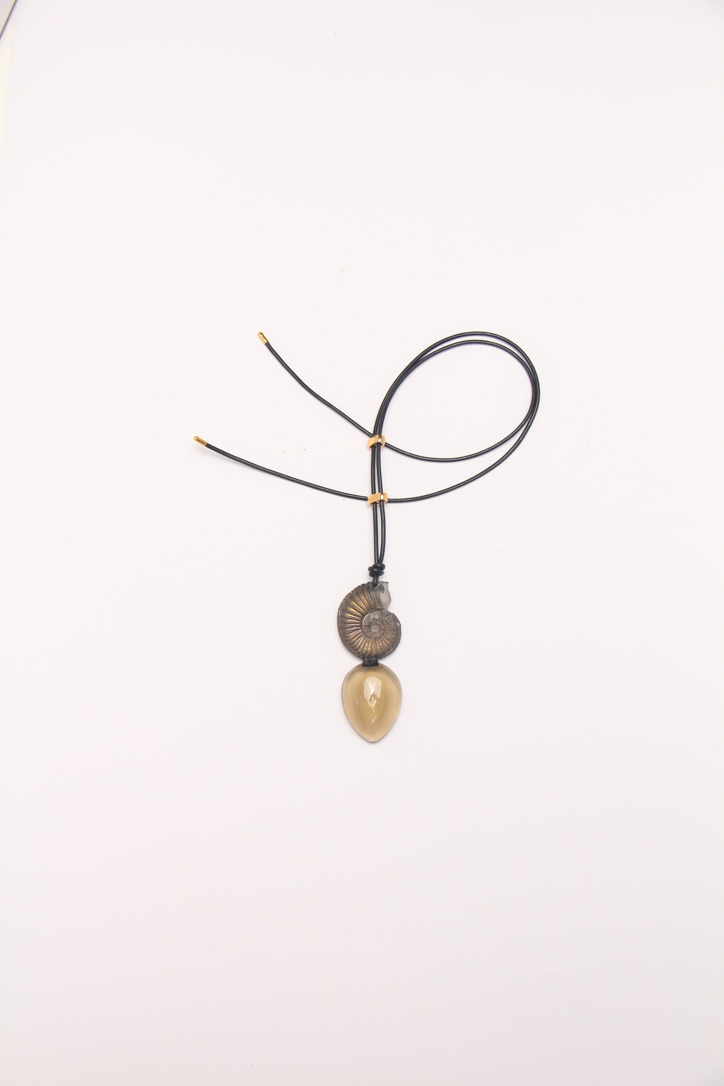 Pendant: ammonite fossil, citrine, leather