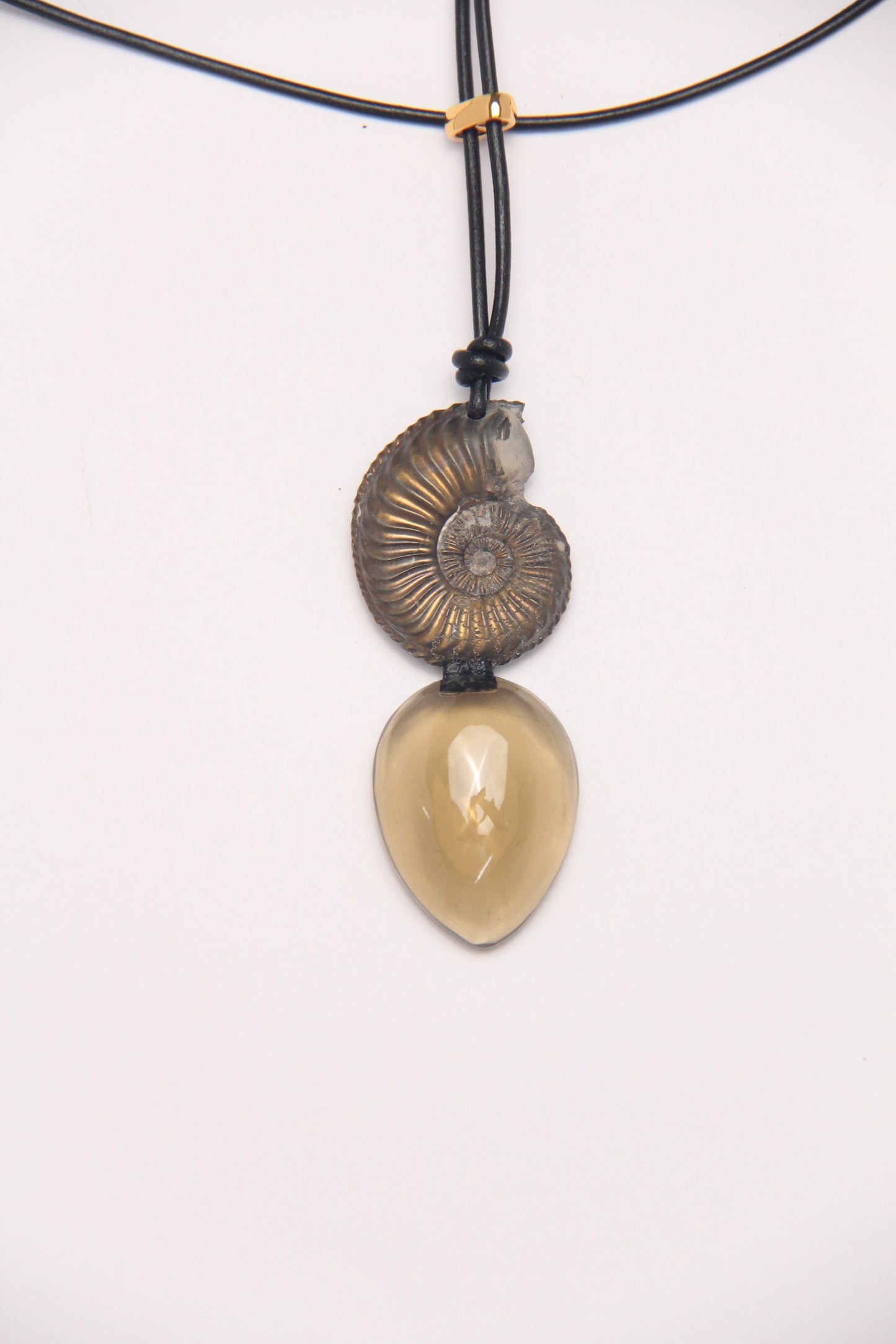 Pendant: ammonite fossil, citrine, leather