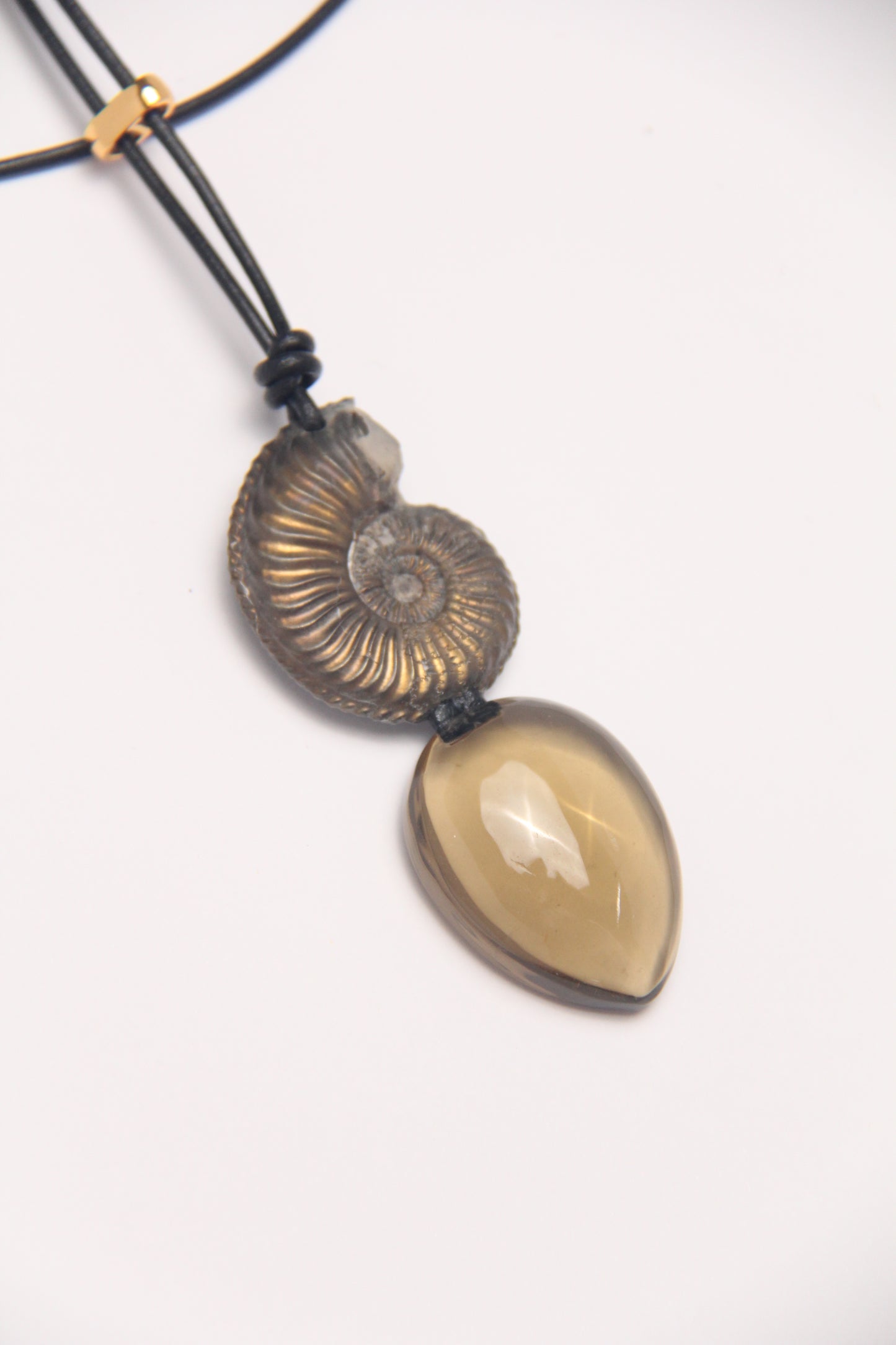 Pendant: ammonite fossil, citrine, leather