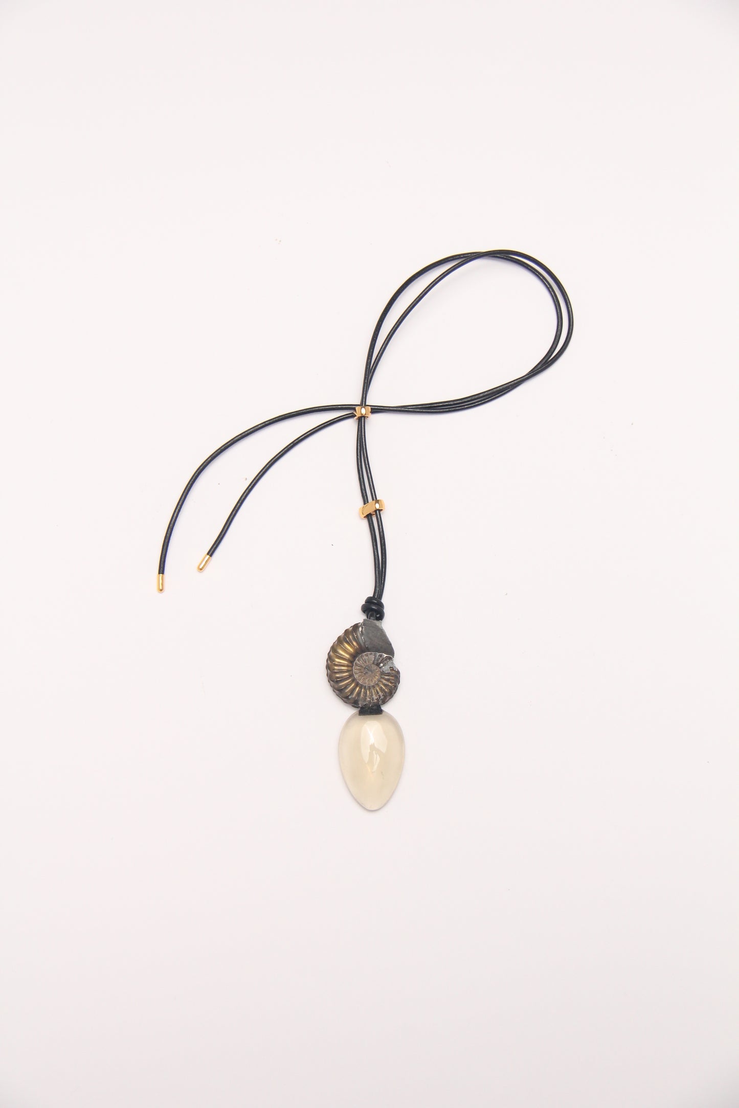 Pendant: ammonite fossil, citrine, leather