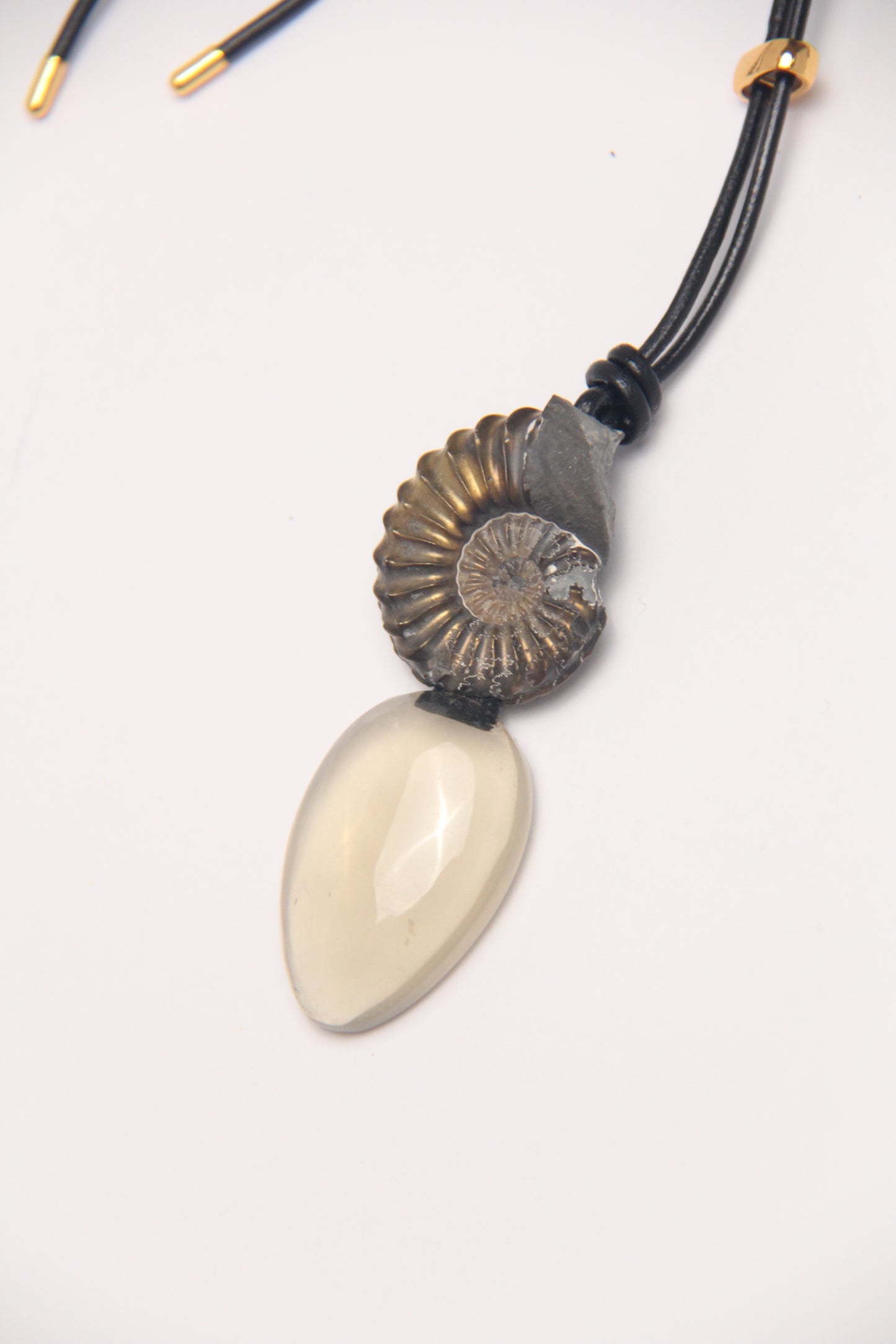 Pendant: ammonite fossil, citrine, leather
