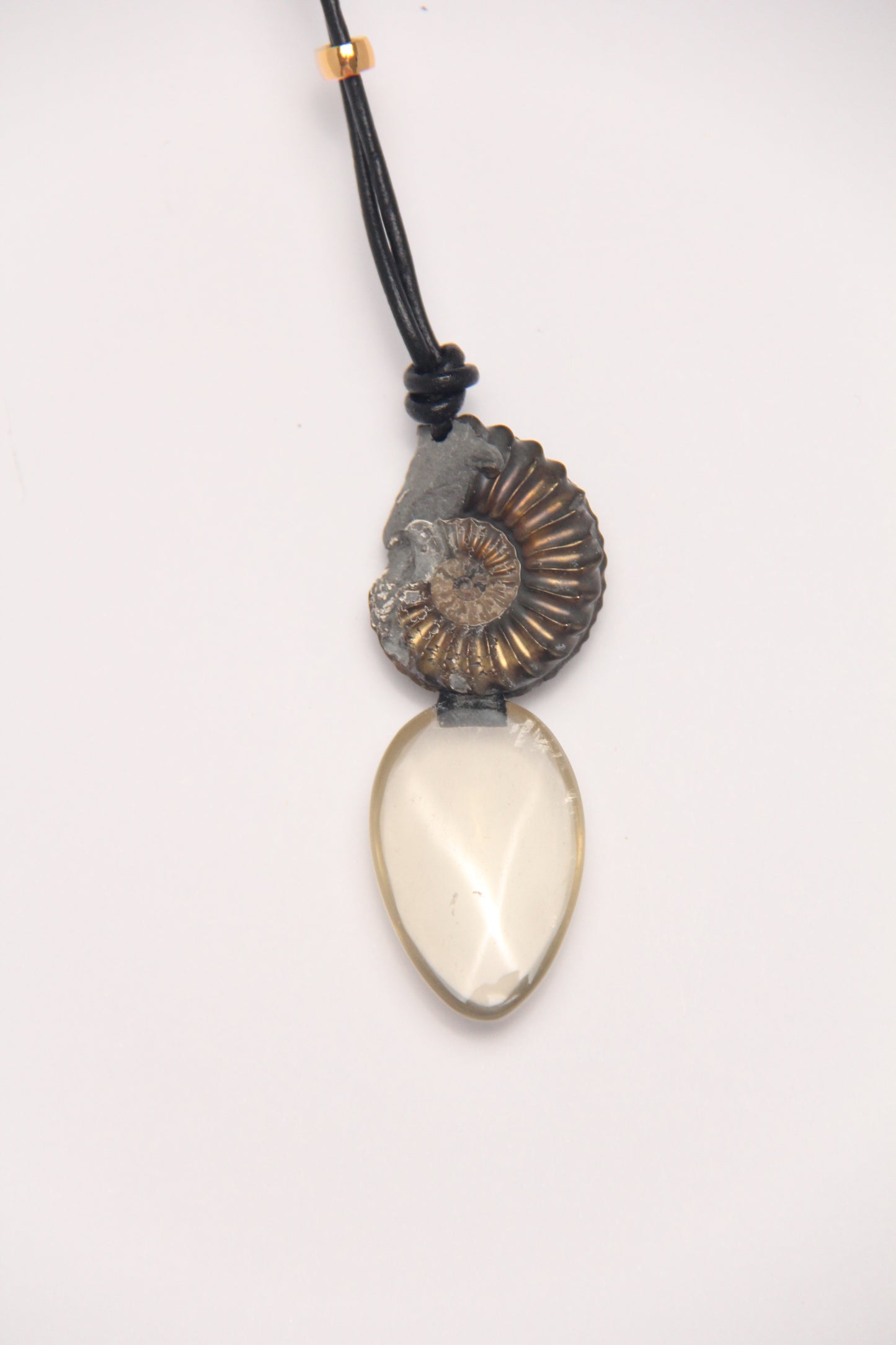 Pendant: ammonite fossil, citrine, leather