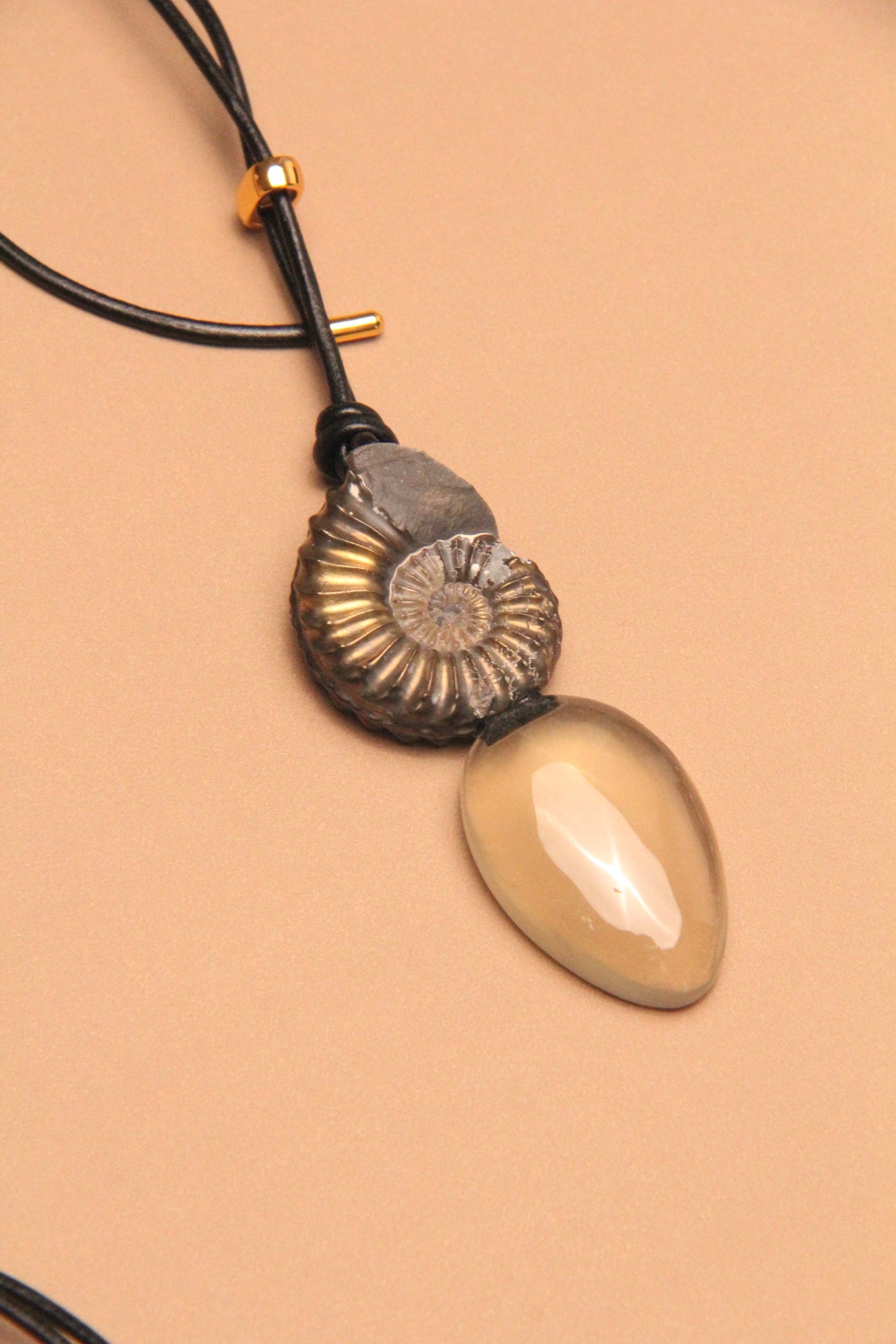 Pendant: ammonite fossil, citrine, leather