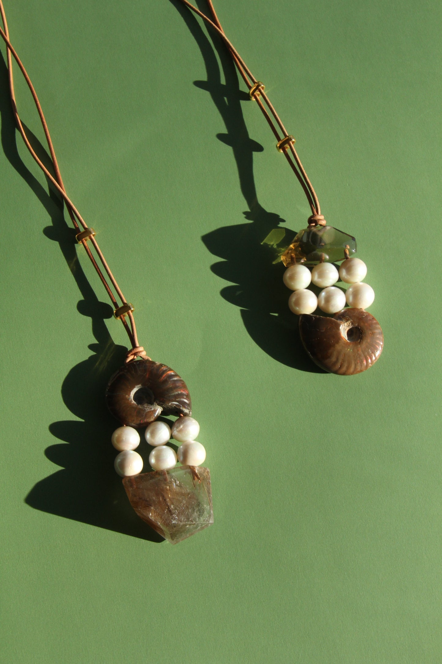 Pendant: ammonite, pearls, rutilated quartz