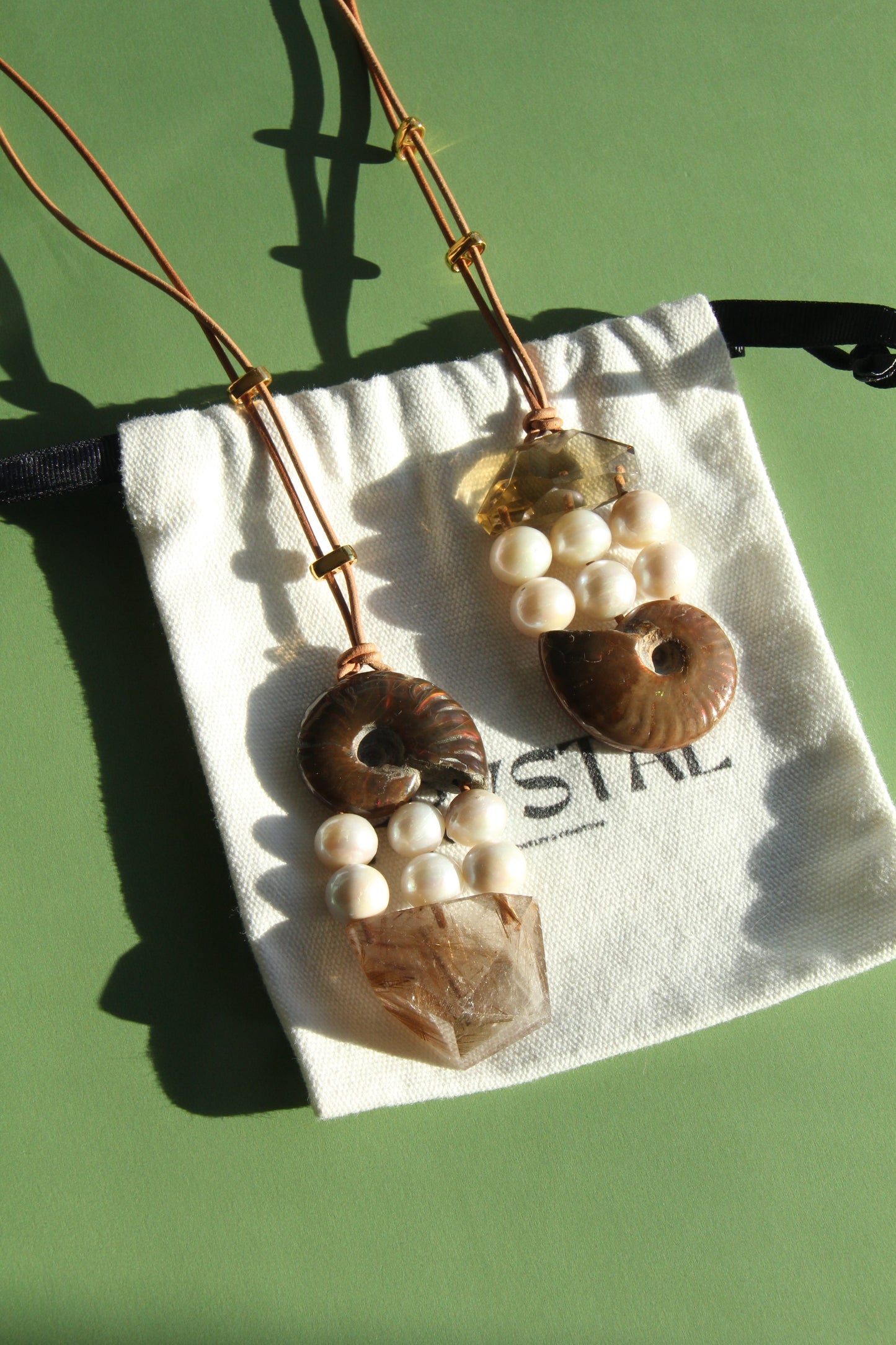 Pendant: ammonite, pearls, rutilated quartz