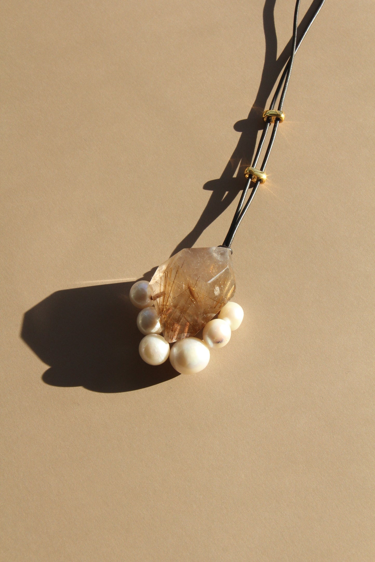 Pendant: rutilated quartz, pearls