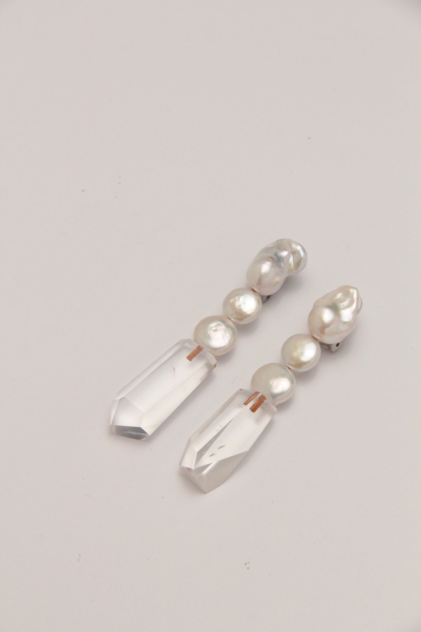 Earrings: pearls, quartz