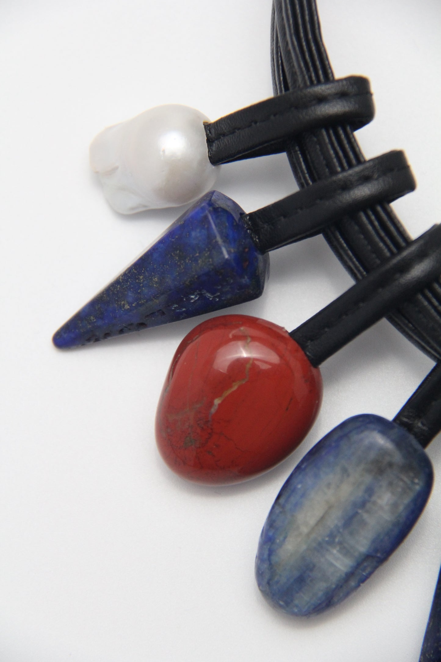 Necklace: Kyanite, lapis lazuli, pearls, red jasper stone, tiger's eye stone