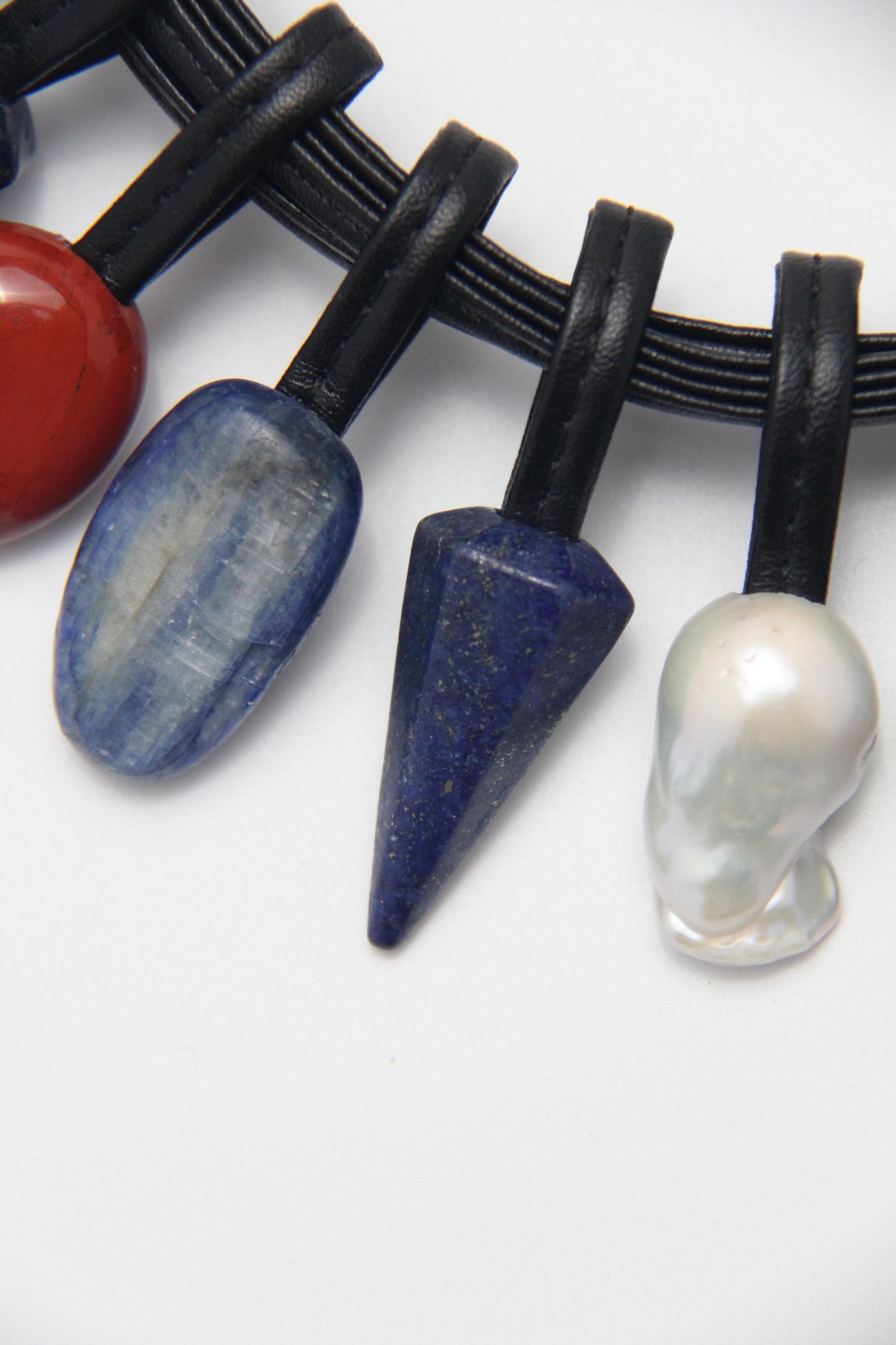 Necklace: Kyanite, lapis lazuli, pearls, red jasper stone, tiger's eye stone