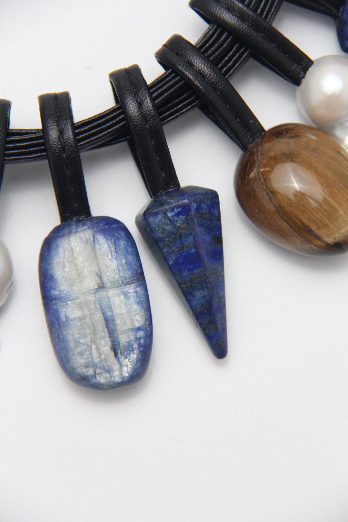 Necklace: Kyanite, lapis lazuli, pearls, red jasper stone, tiger's eye stone