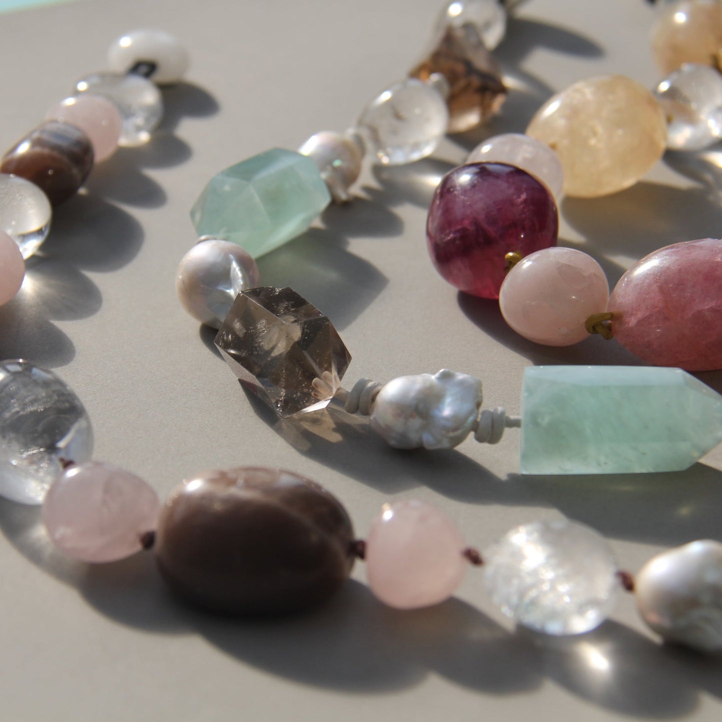 Necklace: fluorite, rose quartz, white crystal, pearl