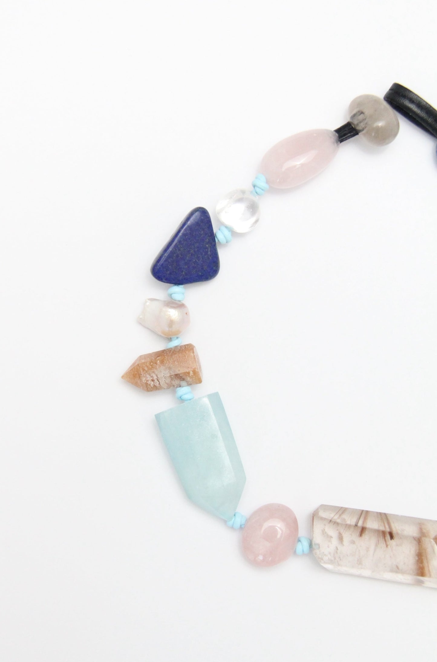 Necklace: golden hair rutilated quartz, aquamarine, kyanite, lapis lazuli, rose quartz, pearl, ghost quartz, white crystal, smoky quartz