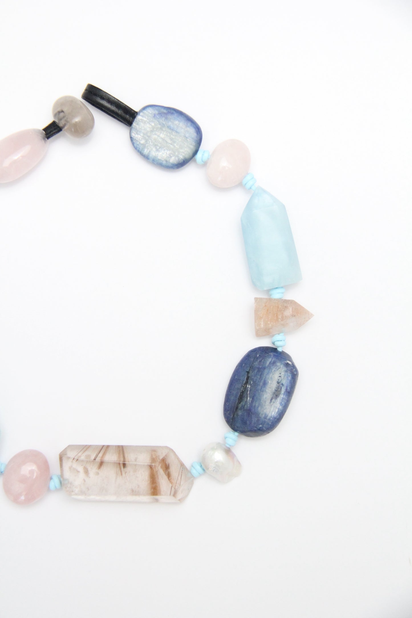 Necklace: golden hair rutilated quartz, aquamarine, kyanite, lapis lazuli, rose quartz, pearl, ghost quartz, white crystal, smoky quartz