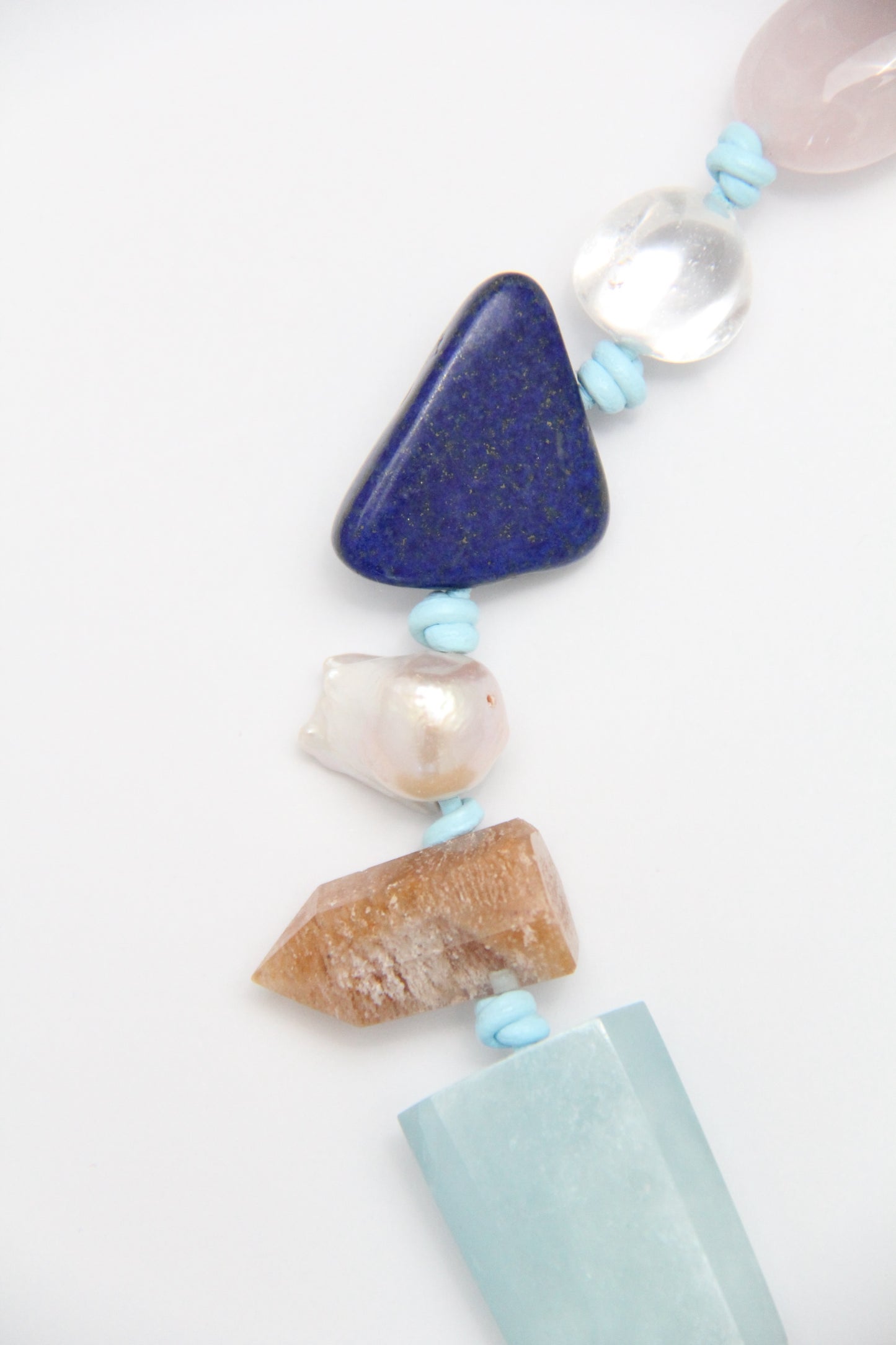 Necklace: golden hair rutilated quartz, aquamarine, kyanite, lapis lazuli, rose quartz, pearl, ghost quartz, white crystal, smoky quartz