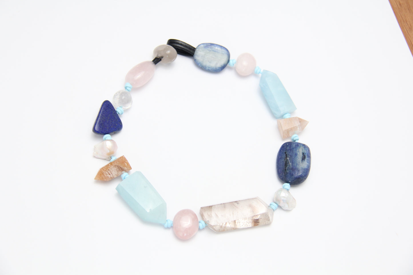 Necklace: golden hair rutilated quartz, aquamarine, kyanite, lapis lazuli, rose quartz, pearl, ghost quartz, white crystal, smoky quartz