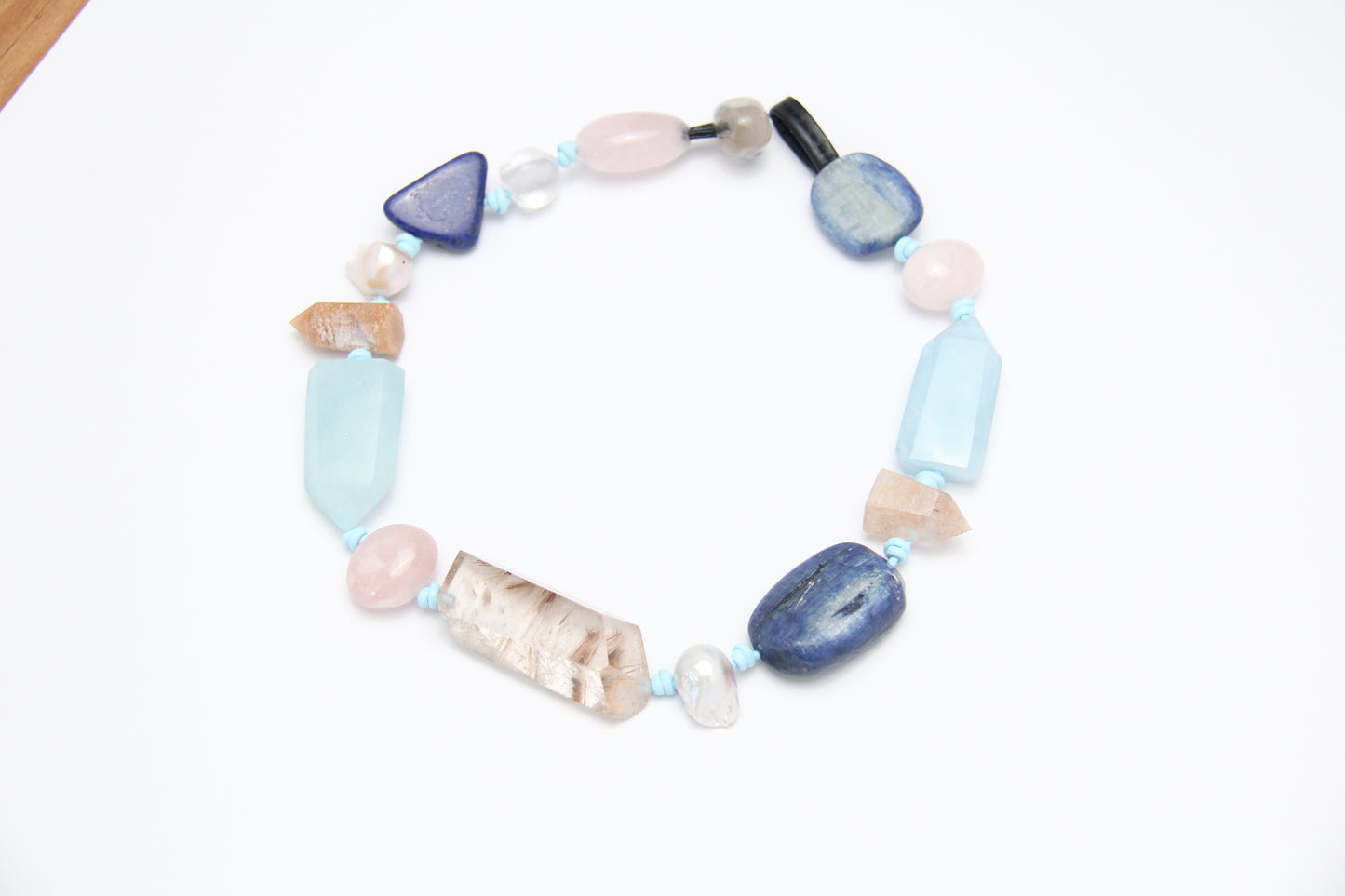 Necklace: golden hair rutilated quartz, aquamarine, kyanite, lapis lazuli, rose quartz, pearl, ghost quartz, white crystal, smoky quartz