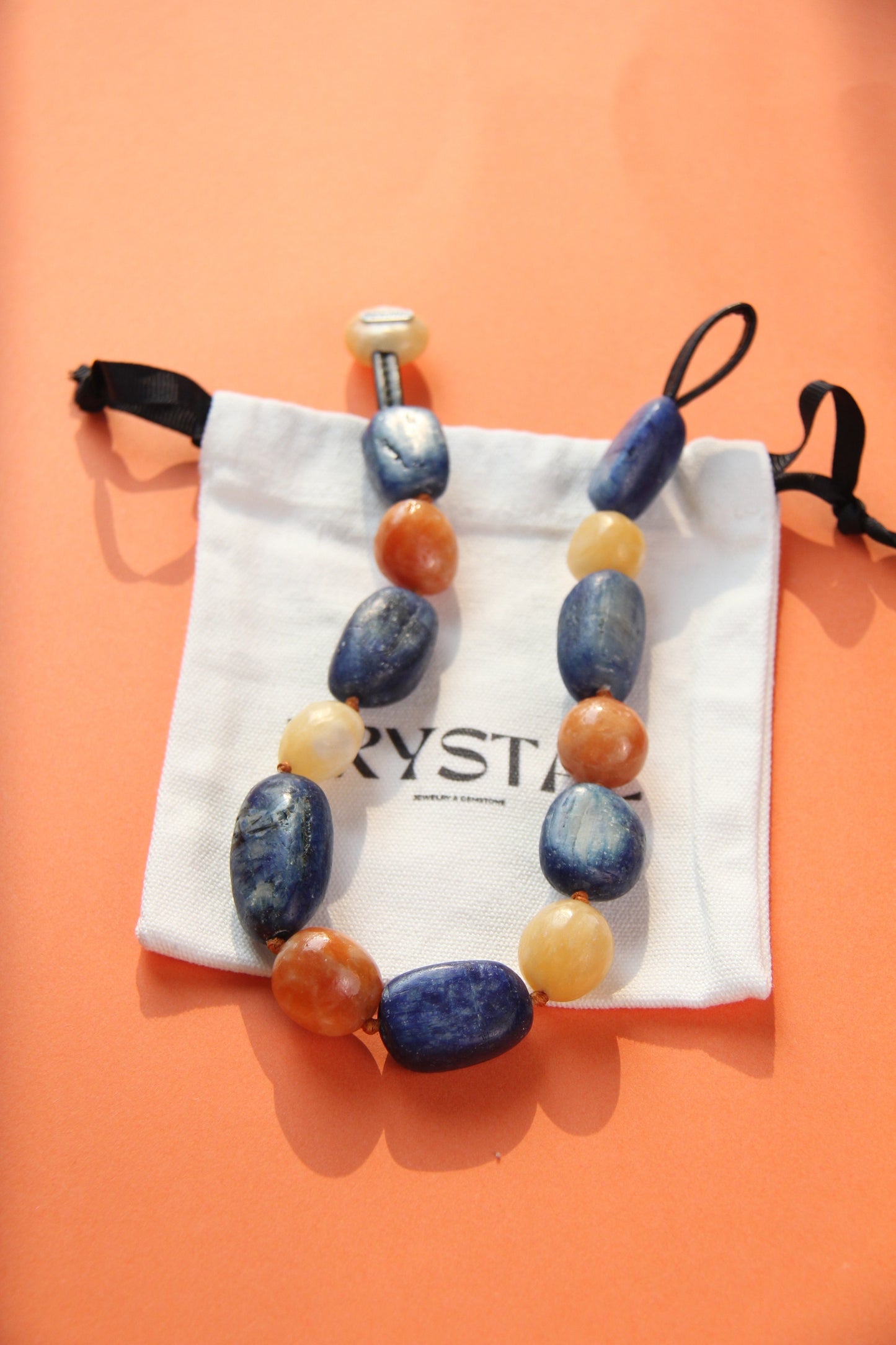 Necklacae: kyanite, calcite, cream yellow onyx