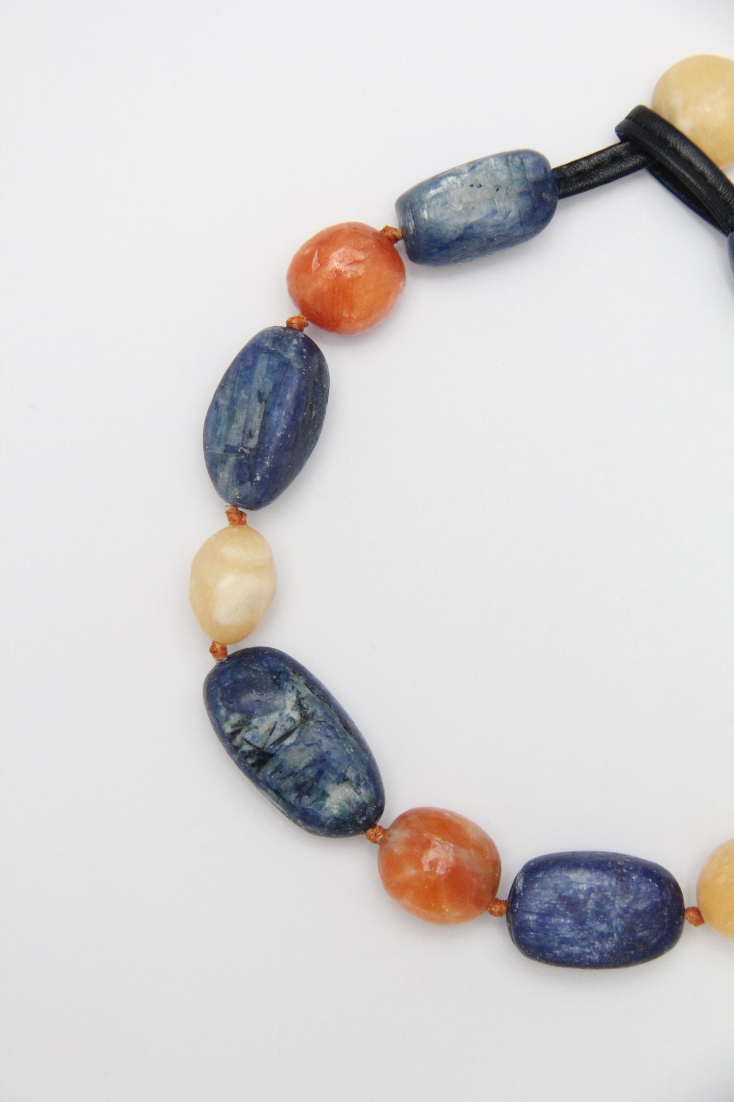 Necklacae: kyanite, calcite, cream yellow onyx