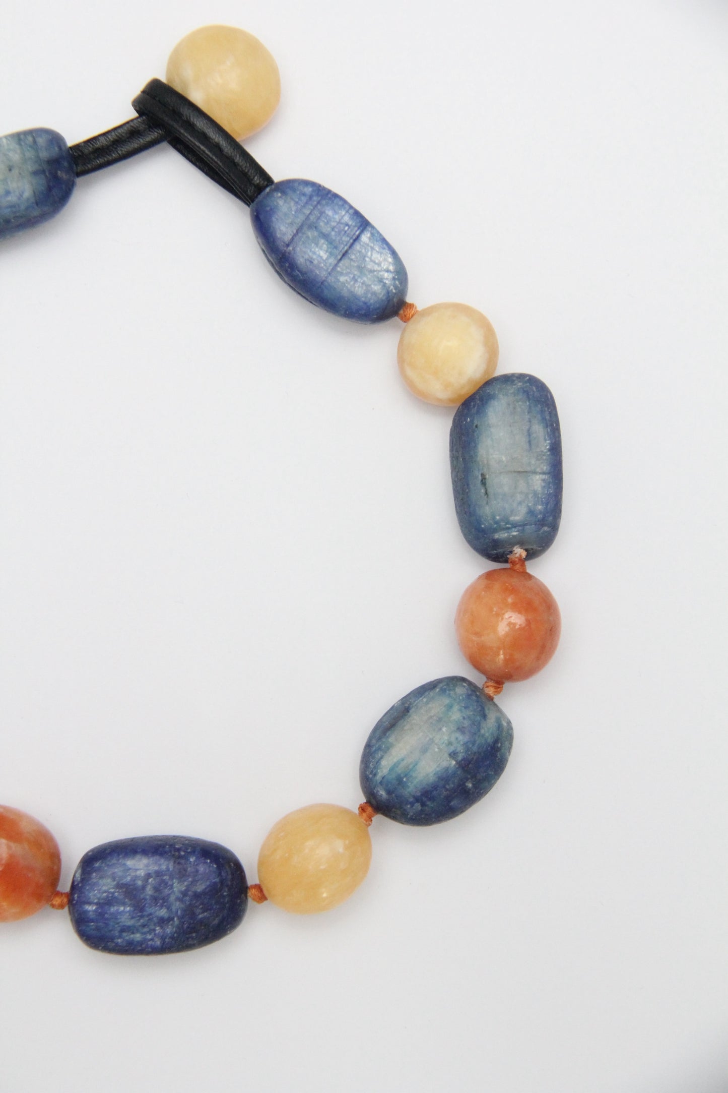 Necklacae: kyanite, calcite, cream yellow onyx