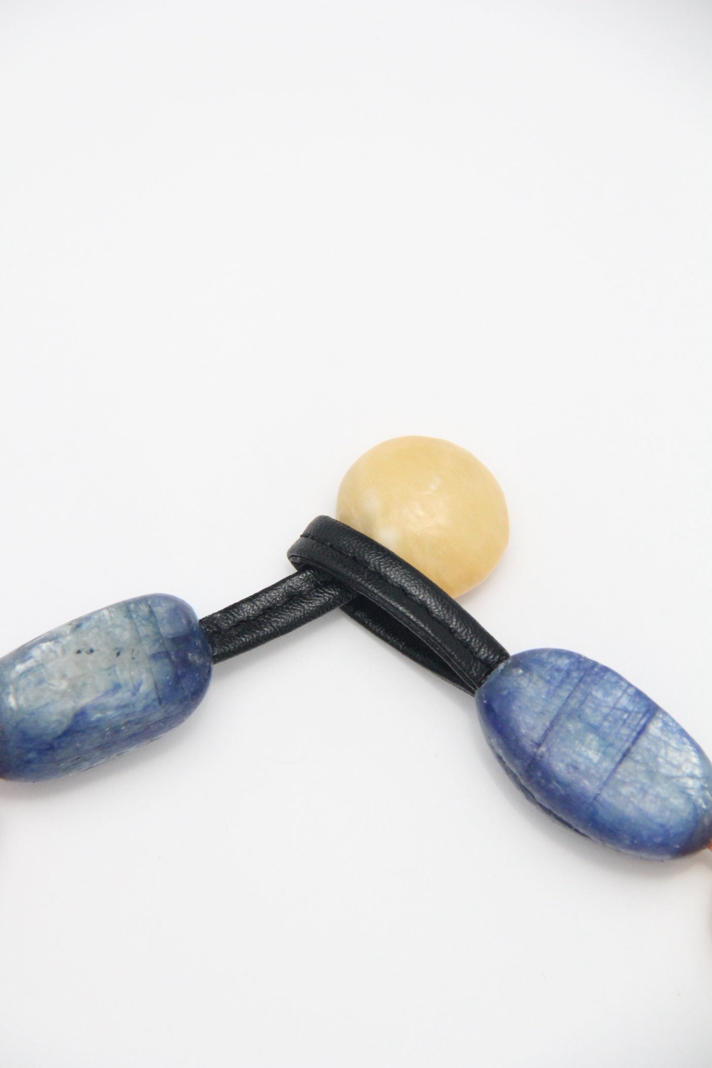 Necklacae: kyanite, calcite, cream yellow onyx