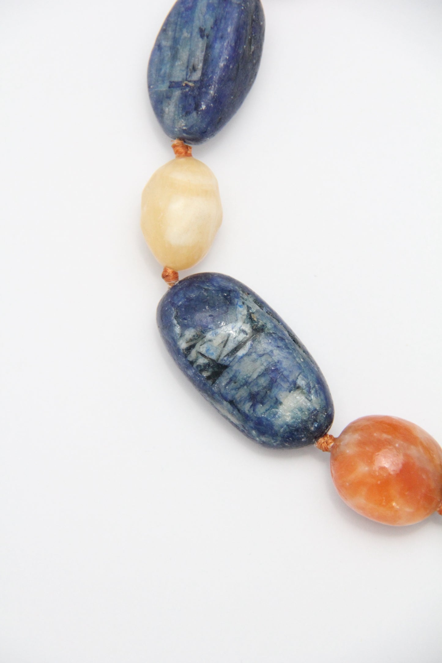 Necklacae: kyanite, calcite, cream yellow onyx