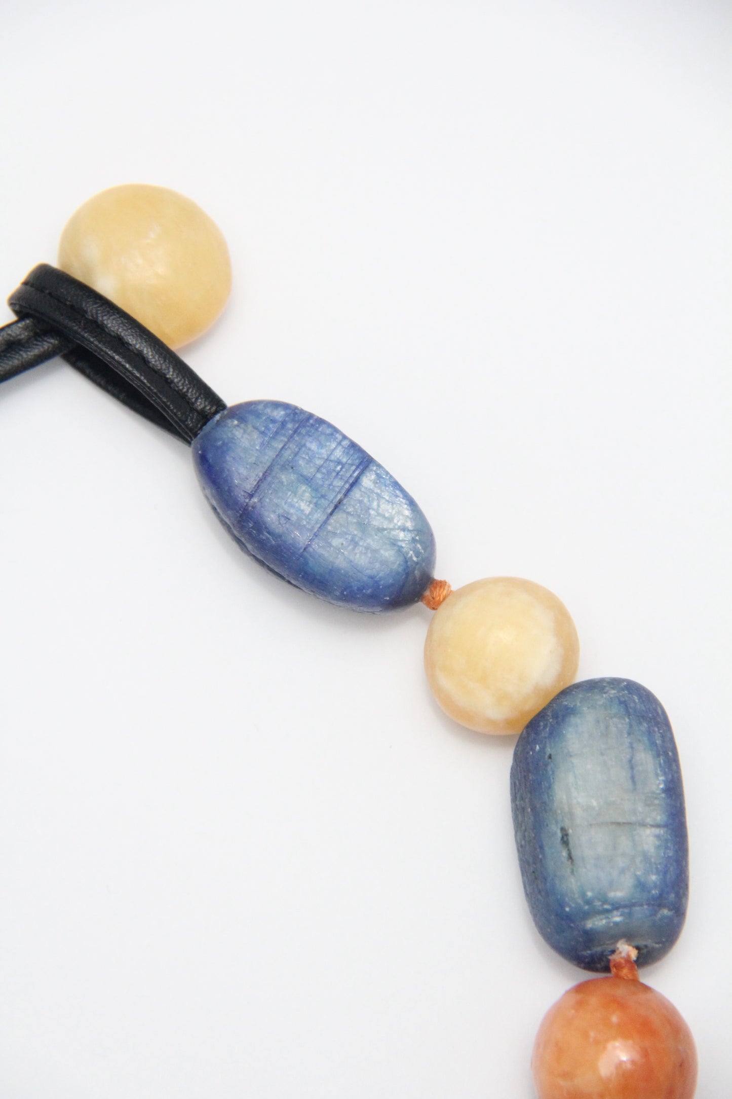 Necklacae: kyanite, calcite, cream yellow onyx