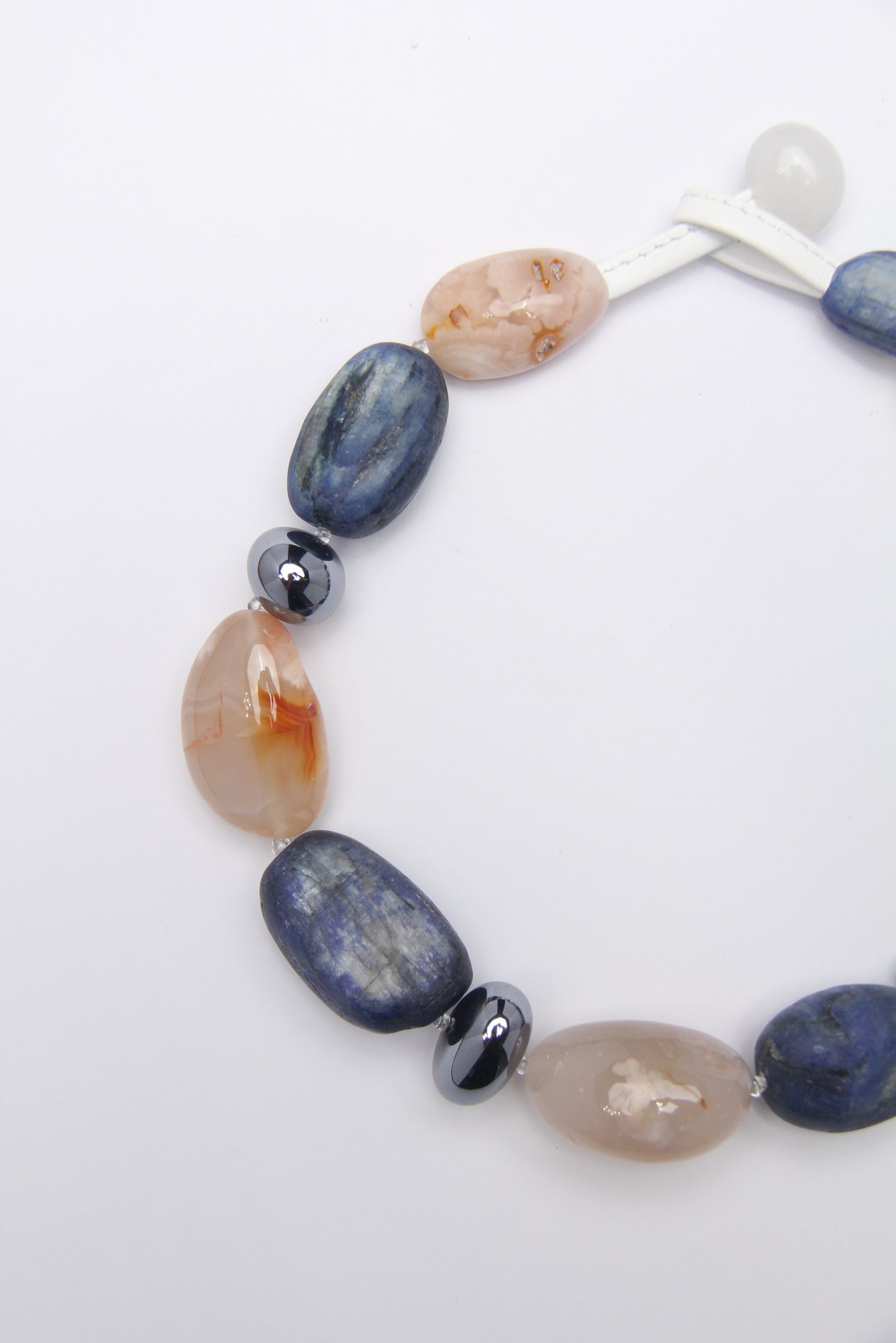 Necklace: kyanite, titanium magnet, rose chalcedony